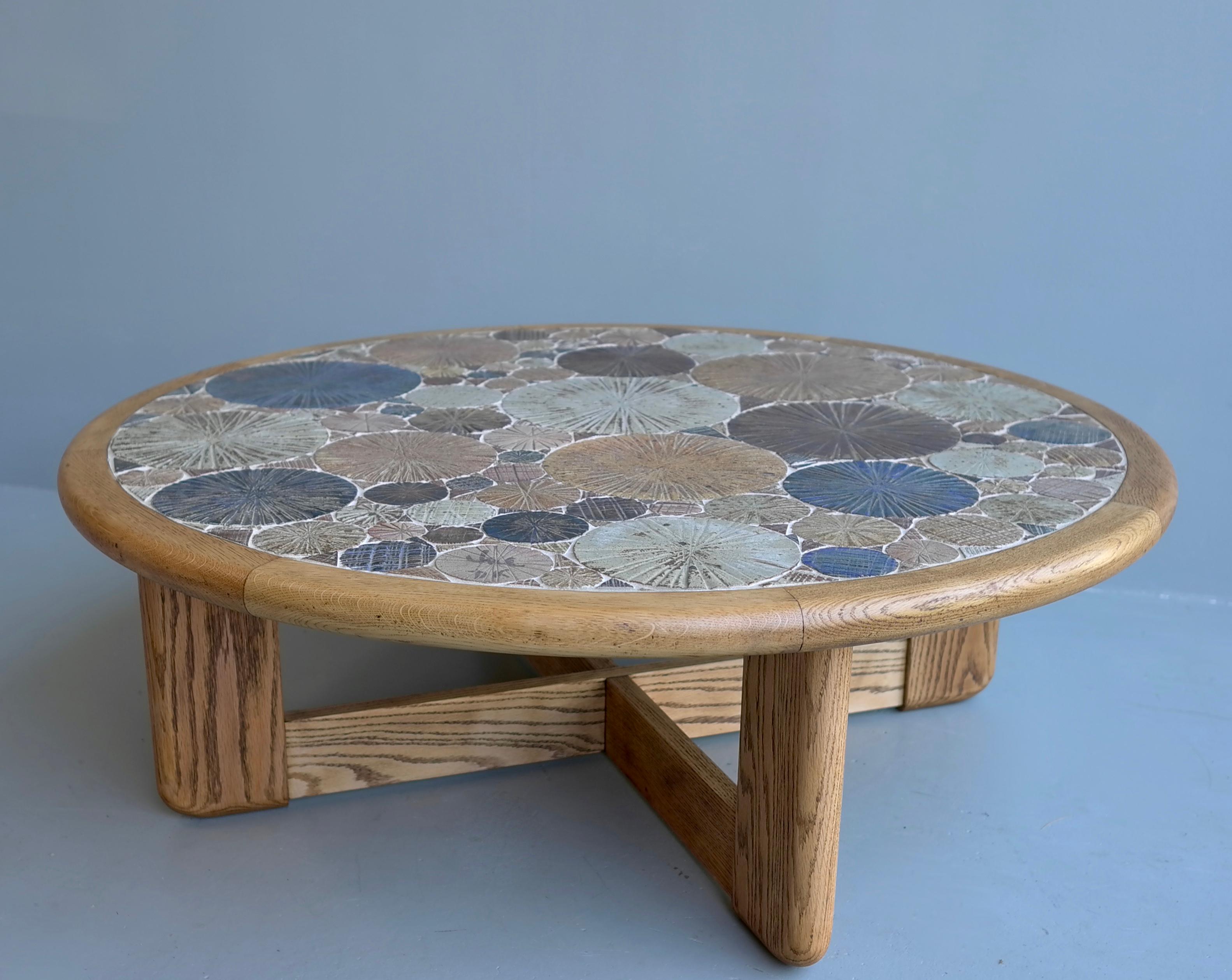 Tue Poulsen round ceramic and oak coffee table
Haslev Møbelsnedkeri A/S, Denmark, 1963
Multi-color textured tiles were handmade by the Danish artist.
Signed by the artist Tue DK.