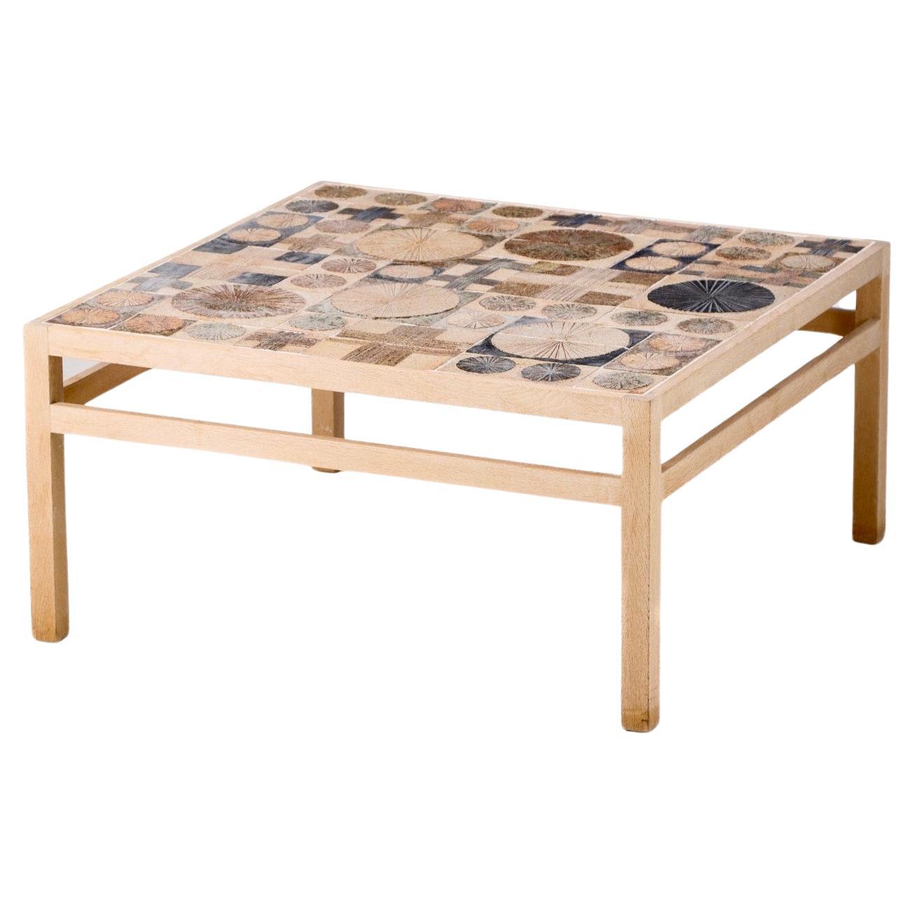 Exquisite large oak coffee table of hand painted tiles by Tue Poulsen (Denmark 1939 - Danish sculptor, artist, designer and ceramist) executed by Master carpenter Willy Beck. 
Table is signed with paper label reading 'Snedkermester Willy Beck