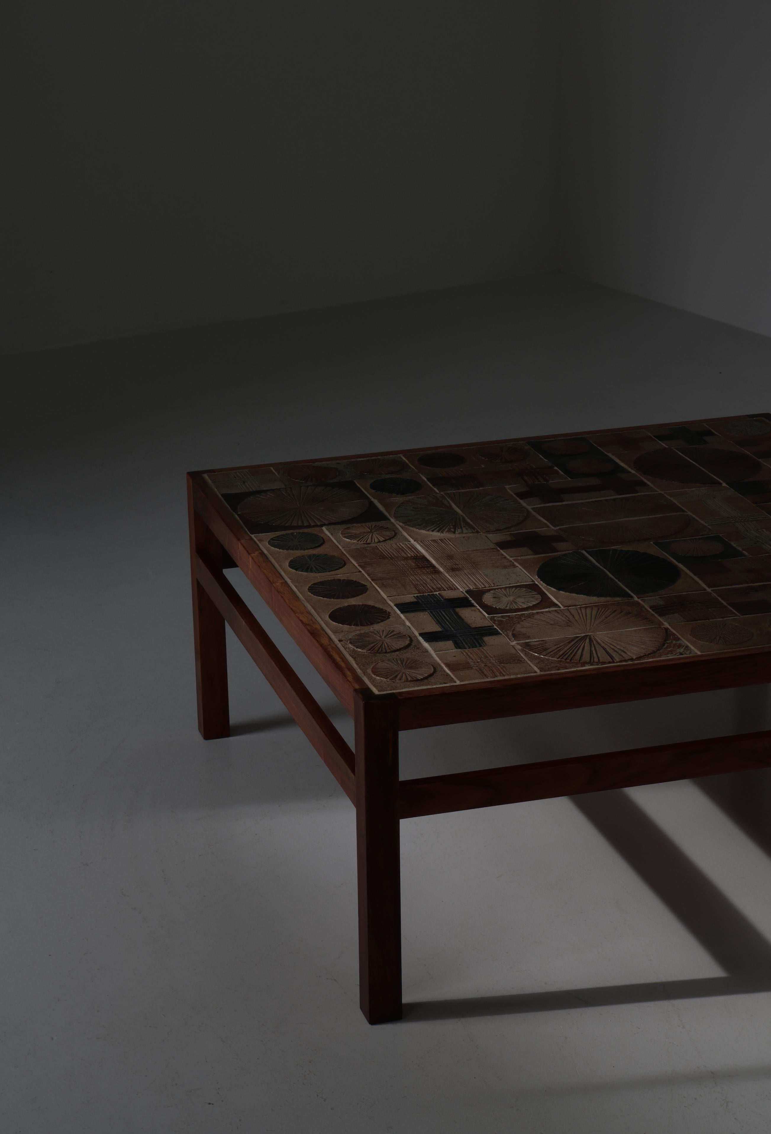 Scandinavian Modern square coffee table by cabinetmaker Willy Beck and artist Tue Poulsen. Made in Denmark in the 1960s. Frame in solid rosewood and top with ceramic tiles. Signed 