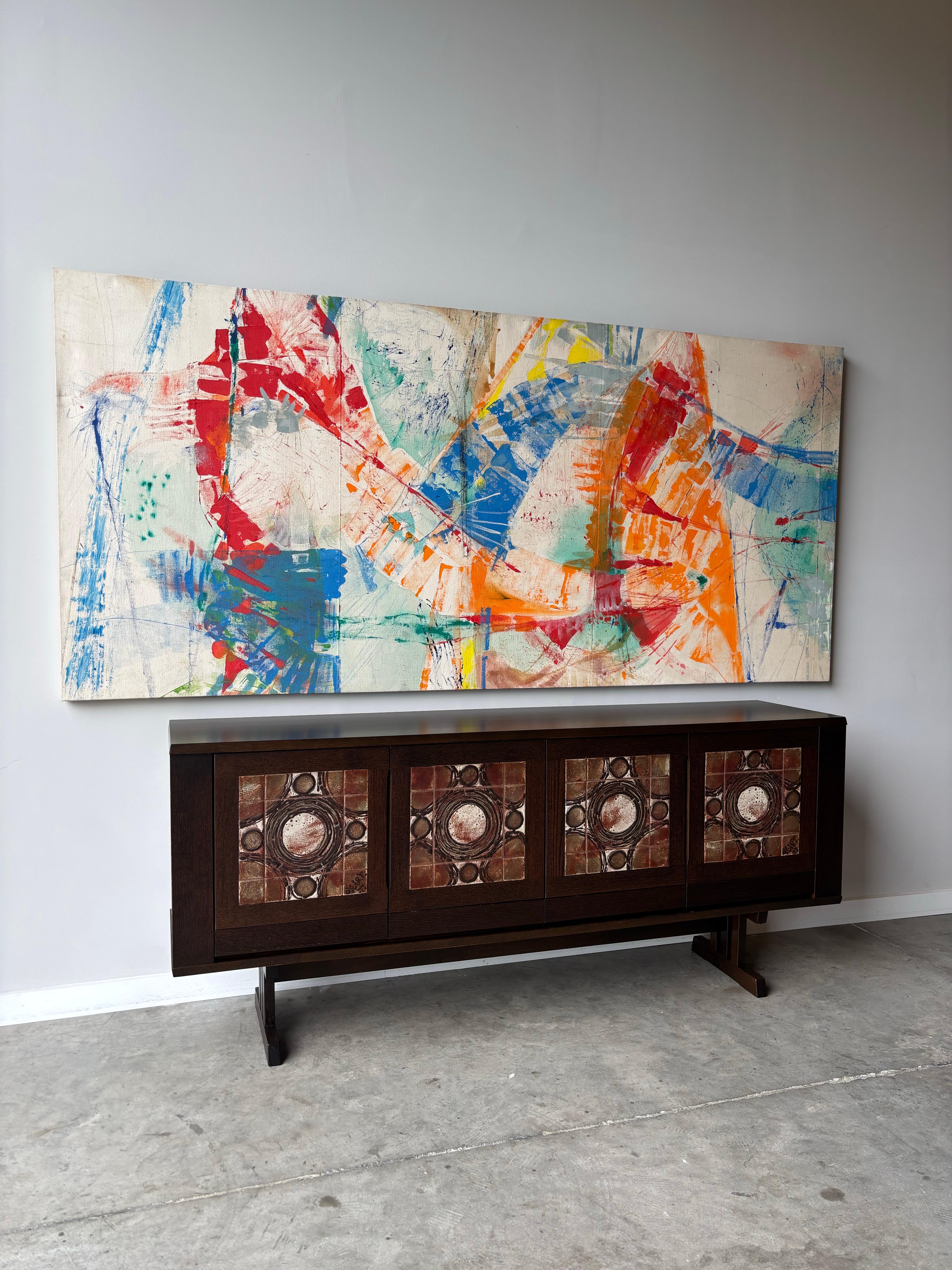 This exceptional mid-century Danish credenza designed by Tue Poulsen captures a distinctive moment in Scandinavian design when the refined minimalism of Danish modern met the raw, architectural boldness of 1970s brutalism. 

The credenza's most