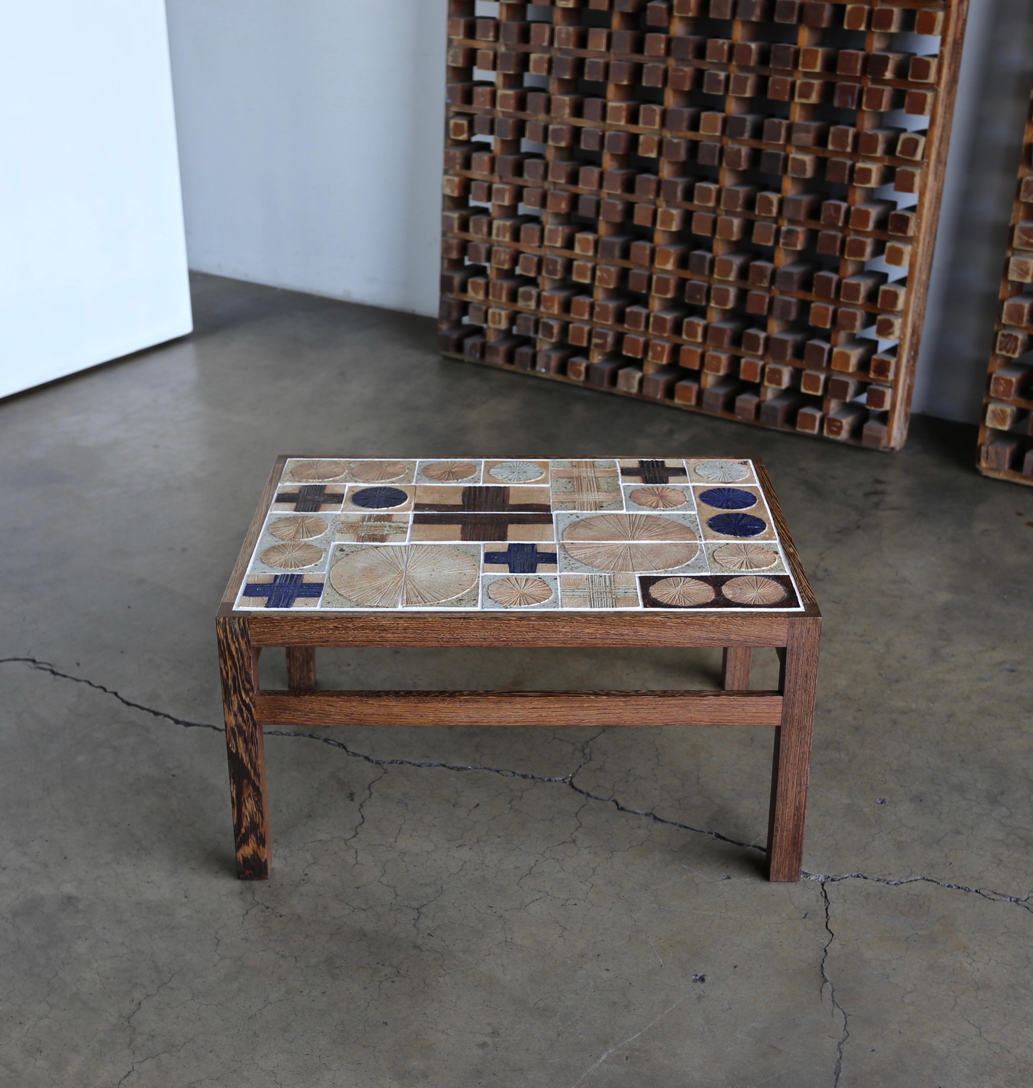 Tue Poulsen & Erik Wørtz ceramic tile top side table for Willy Beck, circa 1965. This piece is signed to the top.