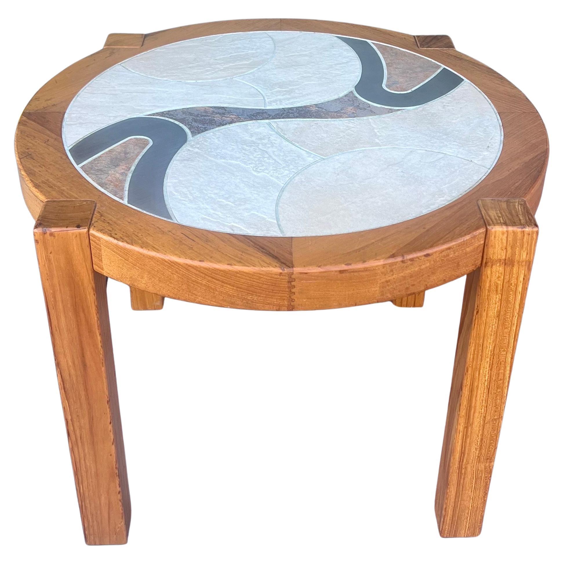 Danish modern side or end table by Tue Poulsen for Haslev Møbelsnedkeri A/S, Denmark. round form top with Solid teak legs. The top is inset with incised, hand-painted. Retains the original brass Haslev tag, we will remove the legs for easy shipping.