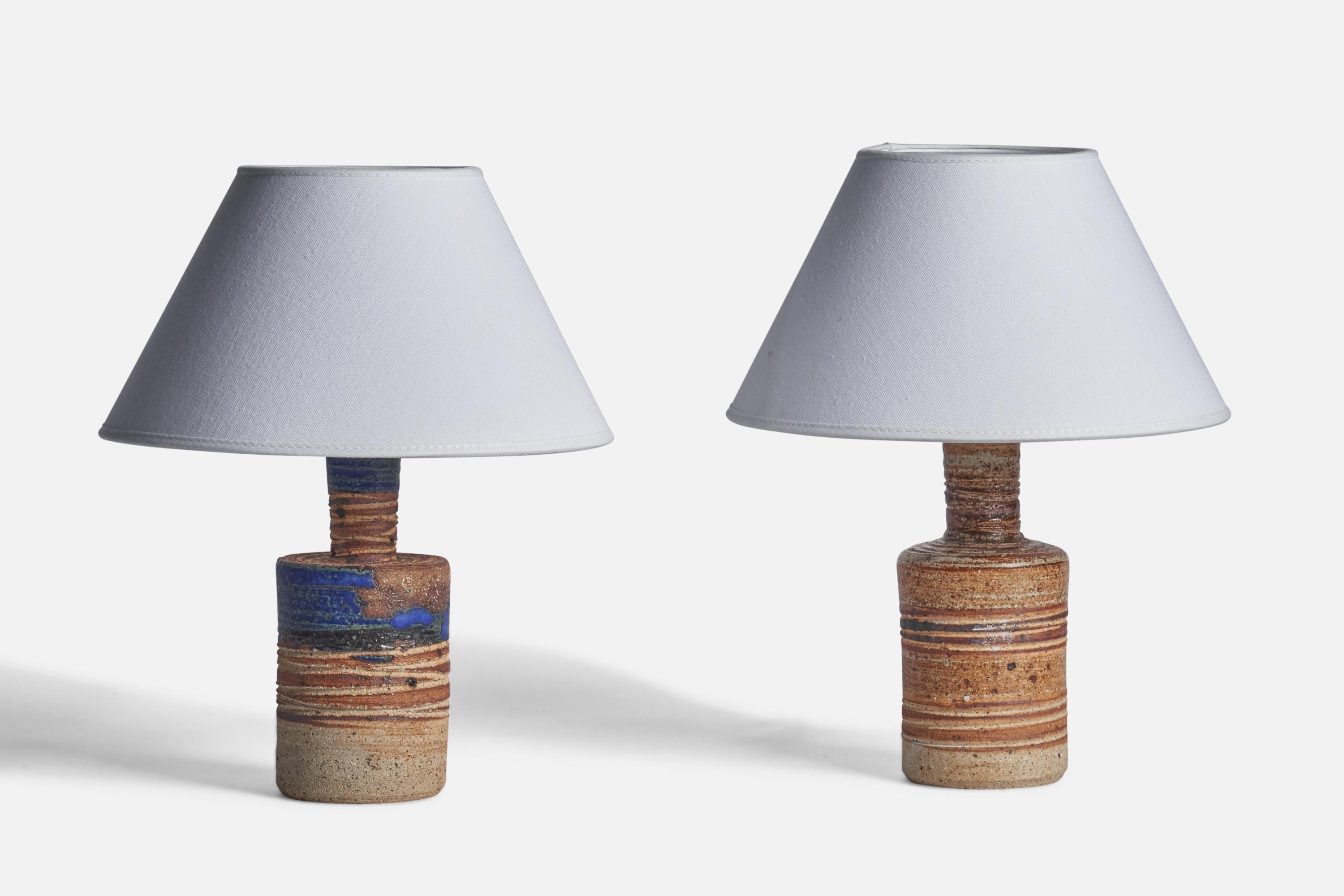 A pair of blue and brown-glazed stoneware table lamps designed and produced by Tue Poulsen, Sweden, 1960s.

Dimensions of Lamp (inches): 9.15