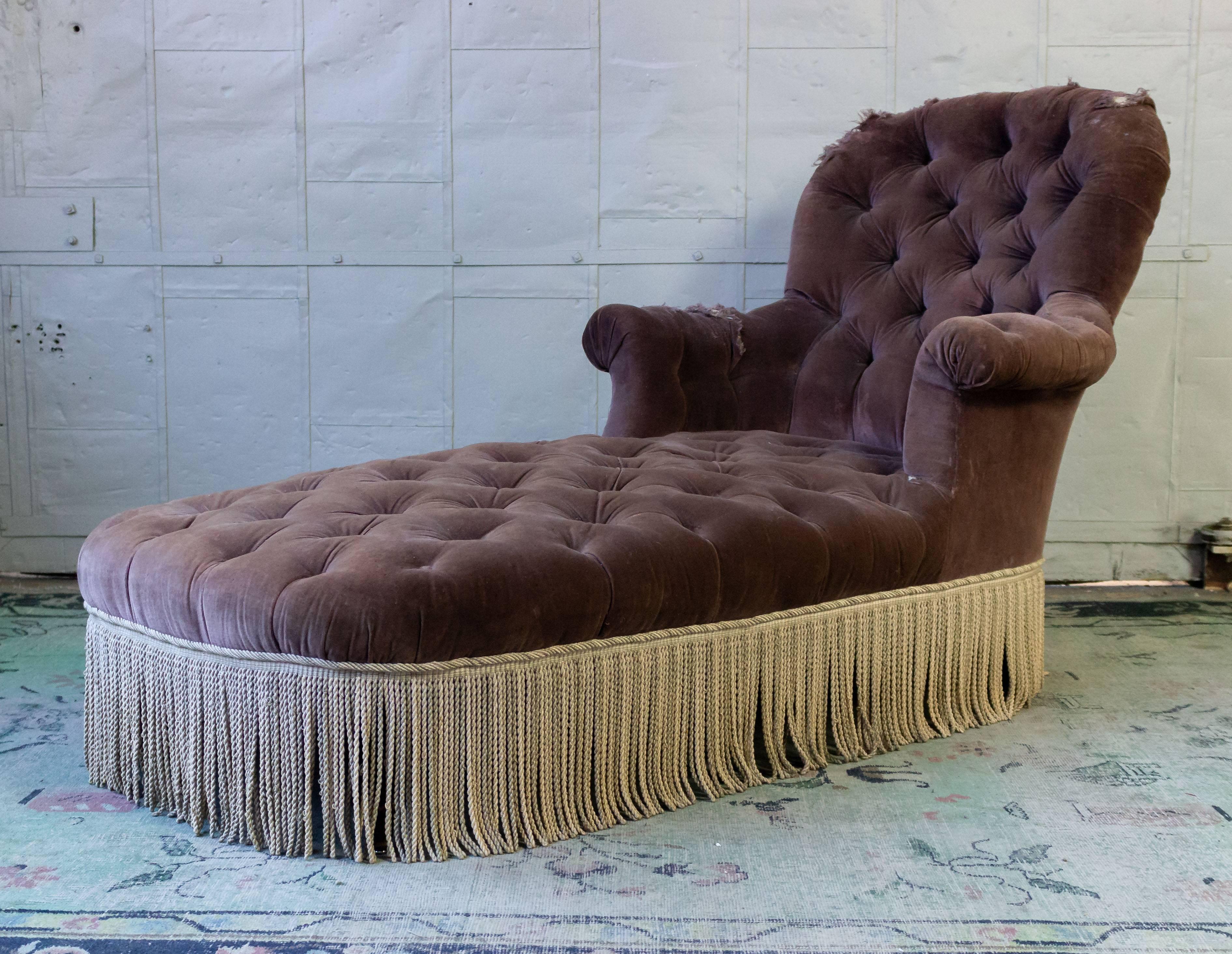 An exceptional French Napoleon III chaise longue. Bring a touch of elegance to your home with this exquisite French 19th century Napoleon III chaise longue. The worn and tattered purple velvet is rich in texture, complemented perfectly by the