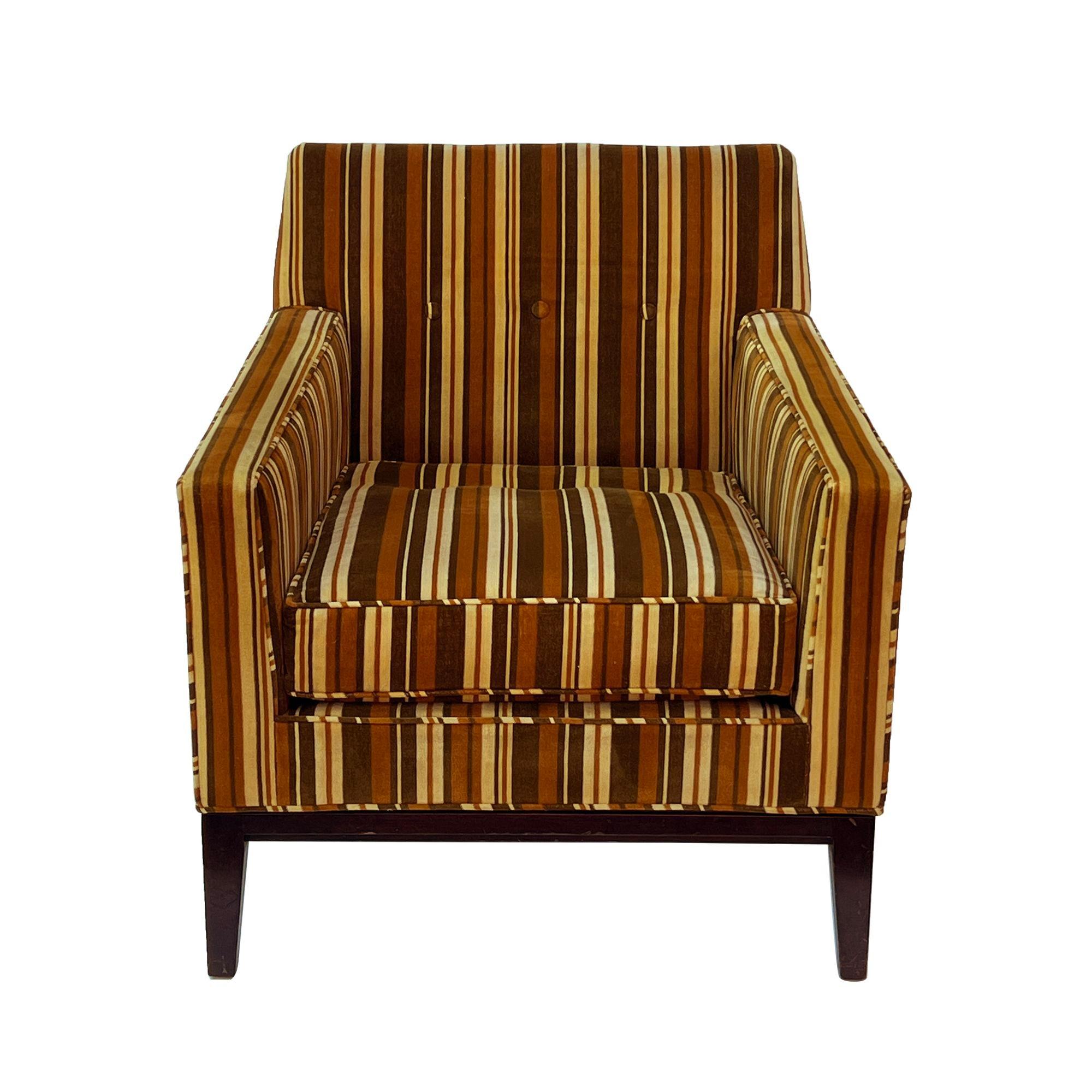 USA, 1960s
Gorgeous angular armchair by Edward Wormley for Dunbar in its original velvet striped upholstery. The details and proportion on this chair are just perfect. The frame angles down toward the back, there's a slight pitch forward at the arm,