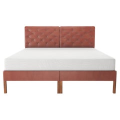 Tufted Bed Shown with Split Headboard on Wood Legs and Covered Rails