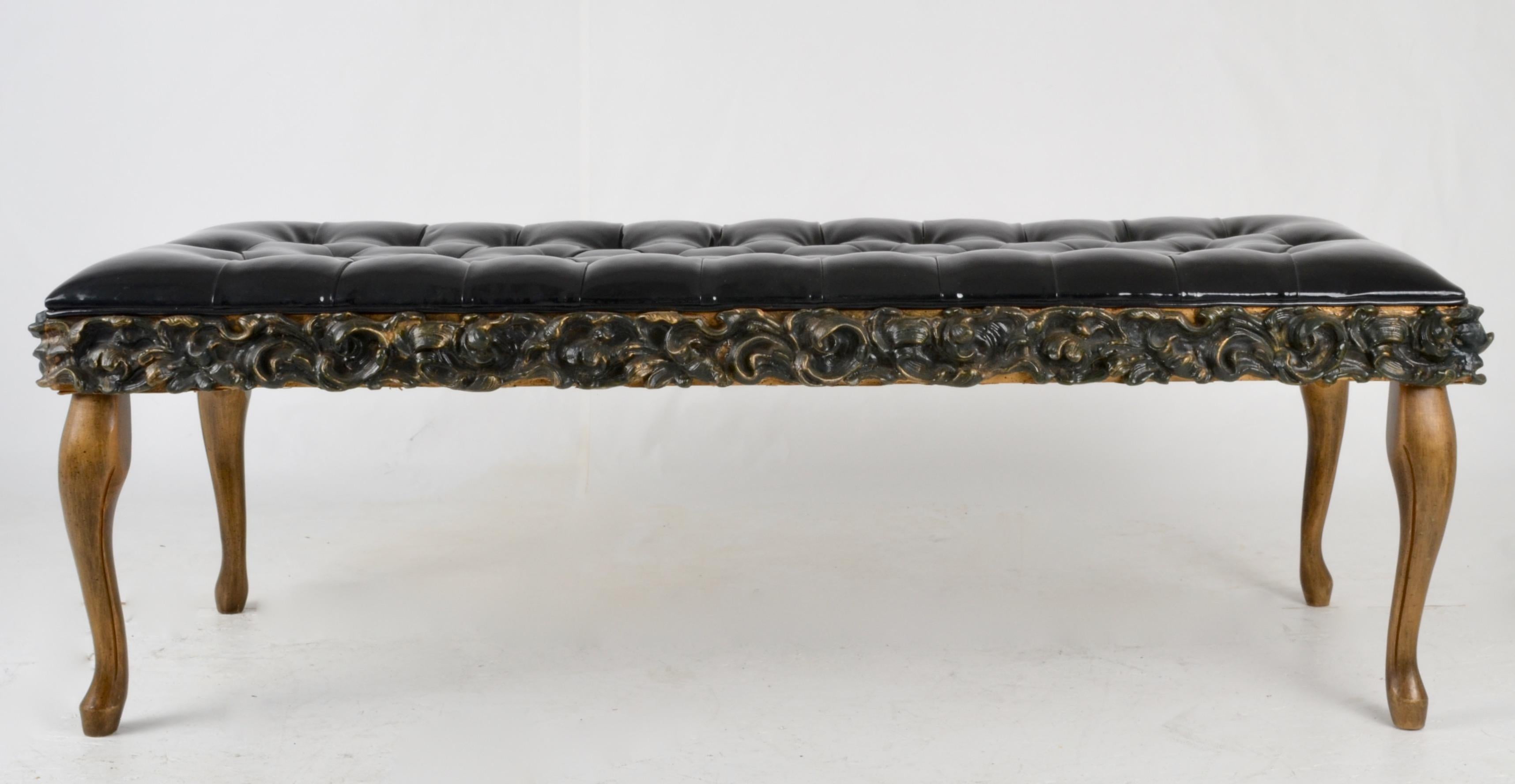 Unusual carved and applied wood decoration bench with a tufted upholstered top in faux patent leather. Nice size.