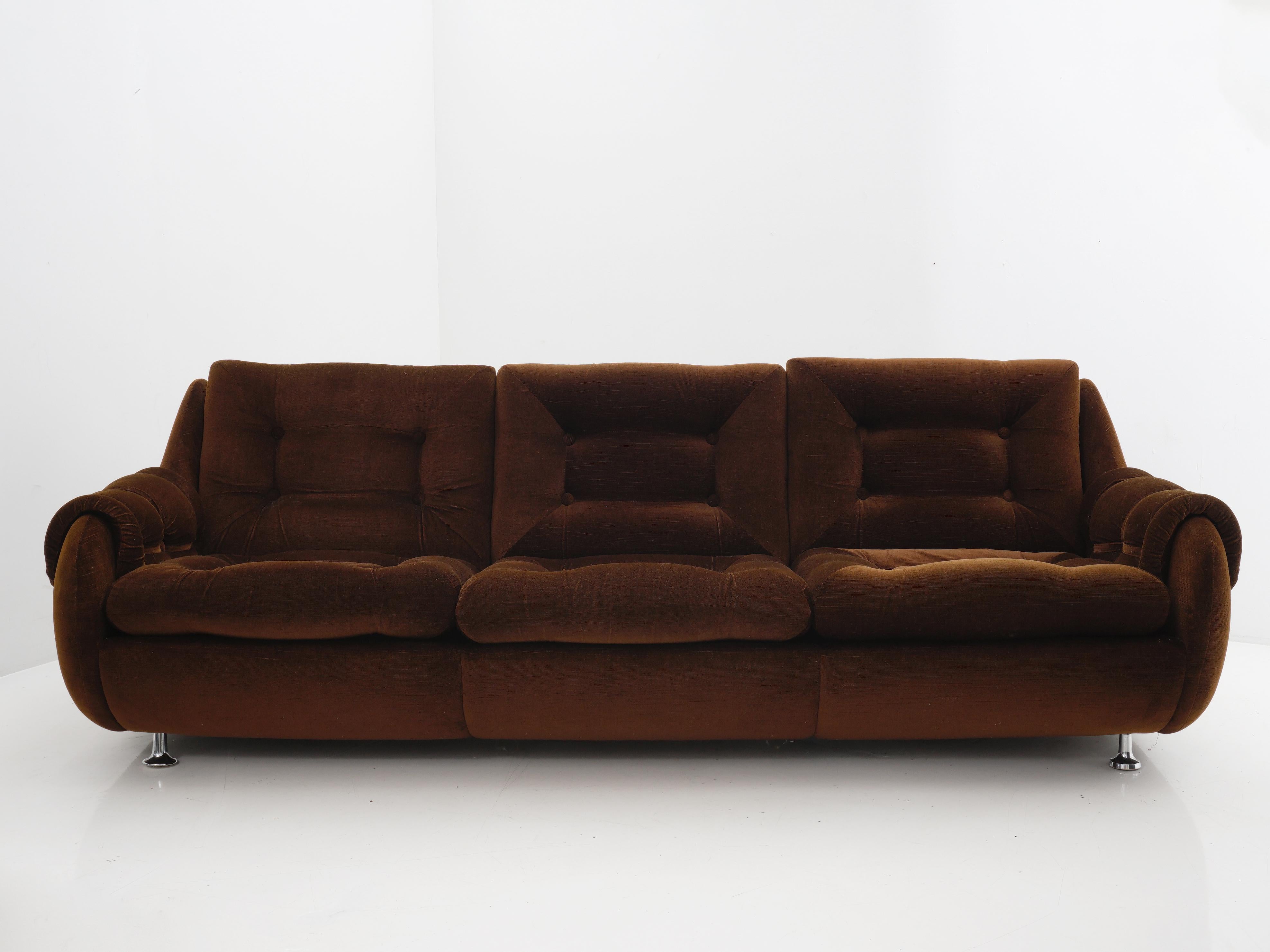 Sink into the lap of midcentury Scandinavian luxury with our rich 1970s brown velvet sofa straight from the design havens of Sweden. It's not just seating, it's a time machine to an era of sleek chrome details and unmatched comfort.

- 29