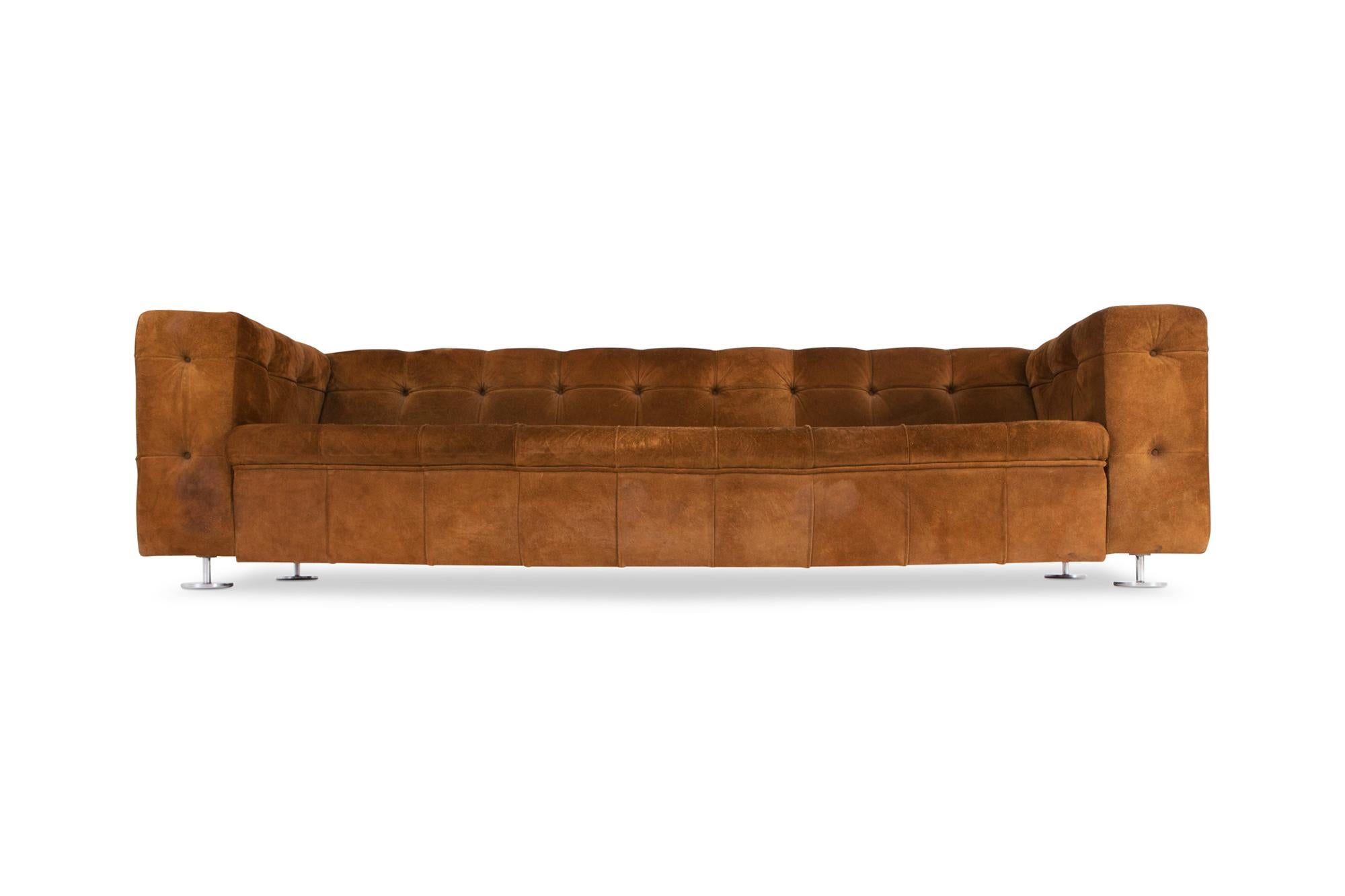 Camel colored suede leather sofa, made in Italy in the 1970s. The tufted design makes it a very cozy piece with a lot of character and patina, like a Mid-Century Modern Chesterfield, also very reminding of the designs of Harvey Probber, Edward