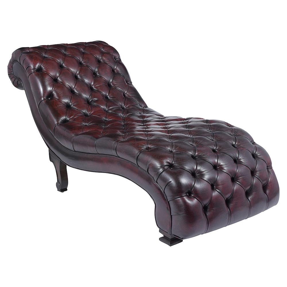 This vintage chesterfield faux leather chaise lounge is in great condition has been newly restored and features tufted upholstery the seat and back are contoured to the human body making it perfect lounging. The faux leather is dyed in a dark
