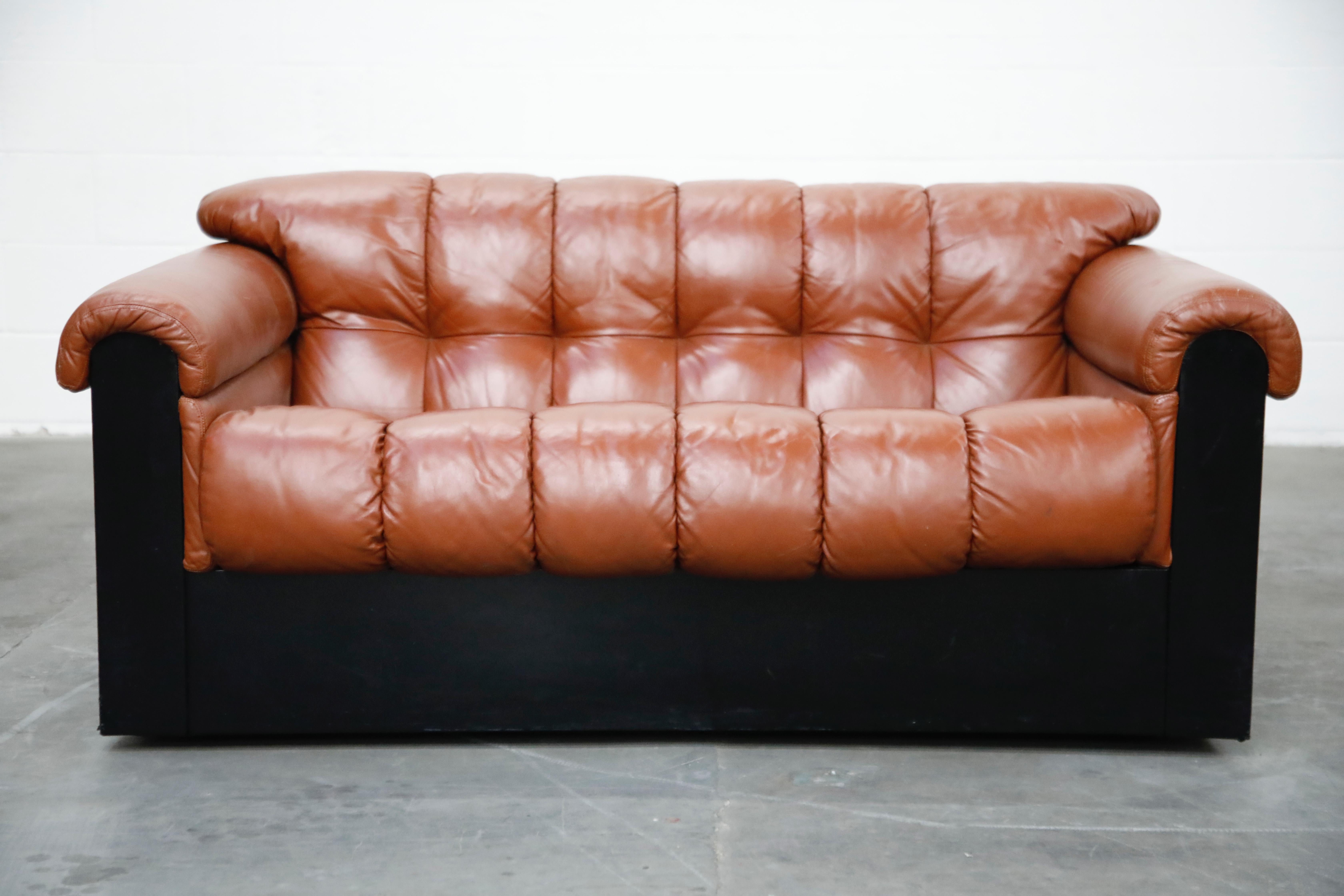 A lovely example of the 'Bounty' series by The Pace Collection in the early 1980s, this deep seated tufted leather loveseat was designed by L. Davantazi and produced by Elam for Pace. 

This tufted settee retains its original supple cognac leather
