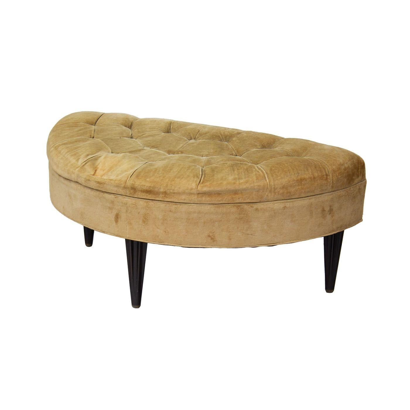 USA, 1950s
Beautiful demilune ottoman by Dunbar. The legs on this piece are really the star- they are shaped / sculpted and each ends in a golden tip. The top is in its original tufted velvet. The foam is hardened and this piece needs new upholstery