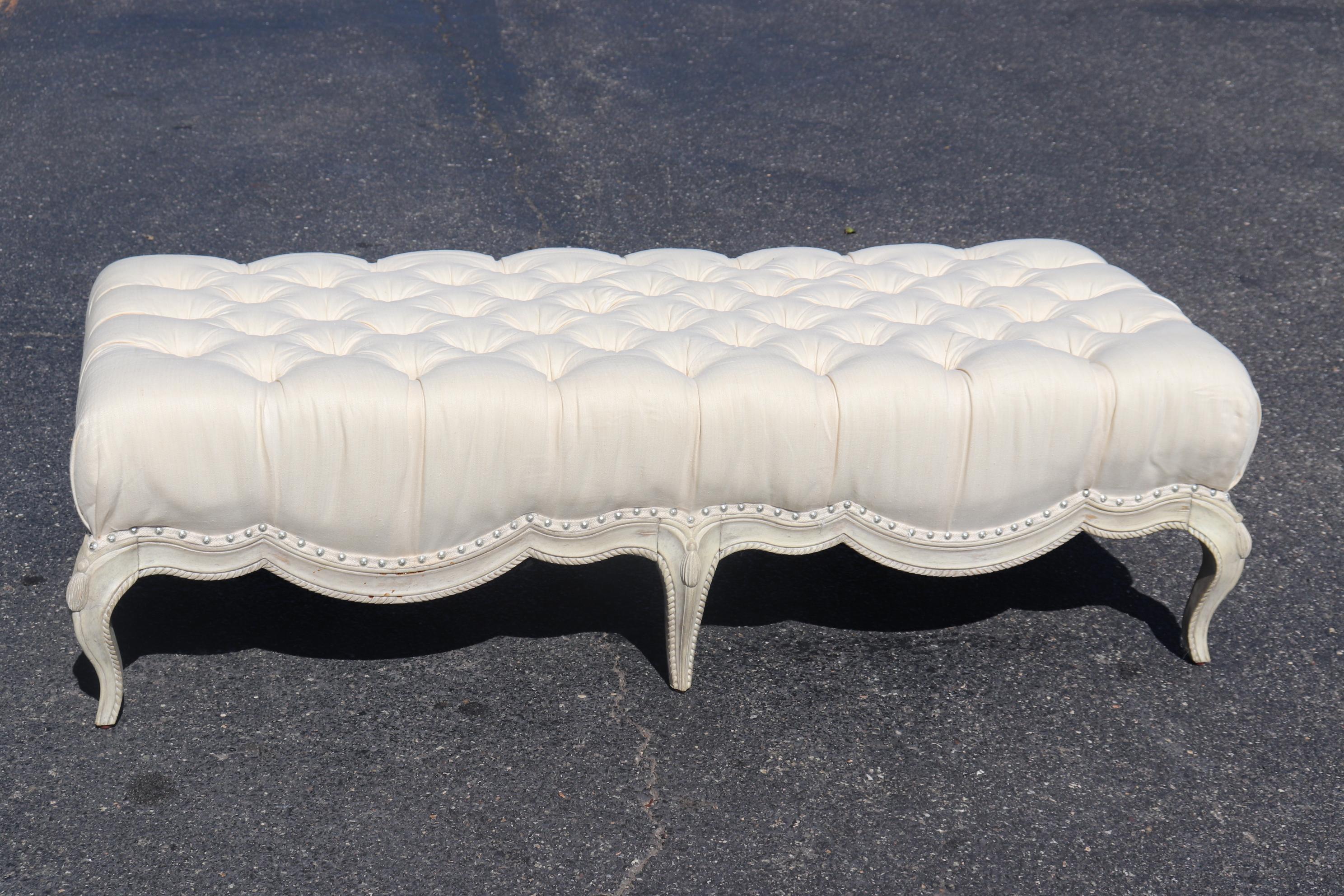 This absolutely fantastic, perfectly neutral and possibly natural linen window bench is perfect for the foot of a queen or even a wide full size bed. The bench is tufted and has a fantastic rope carved and stylized tassle base with a charming
