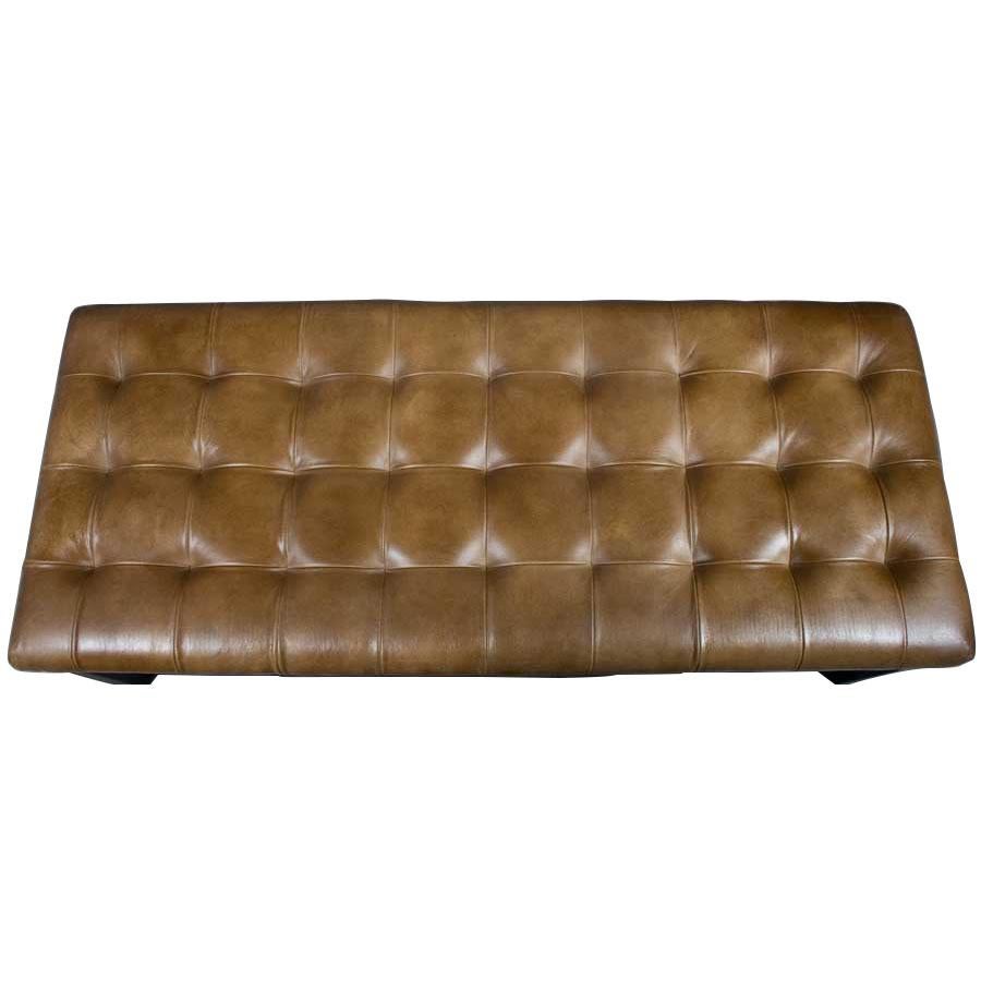 Combining a traditional style with a modern look, this tufted leather bench looks amazing! The soft supple tan leather contrasts the sturdy dark metal of the base nicely. This piece makes a great end of the bed bench, foyer seat, or even an