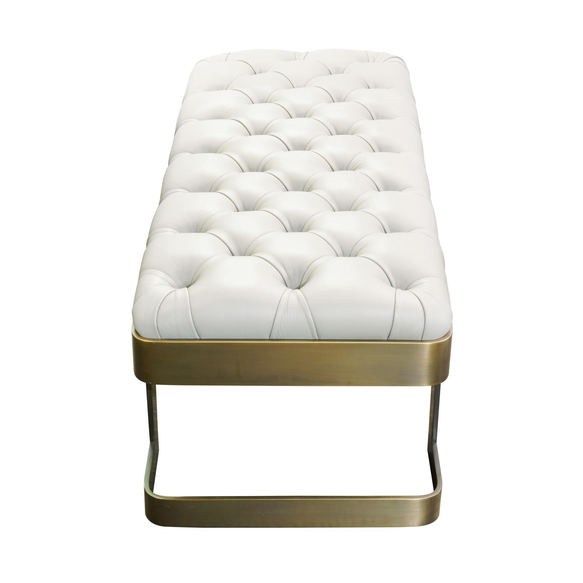 Elegant tufted leather bench with solid bronze legs.
Can be customized to your specifications or COM.