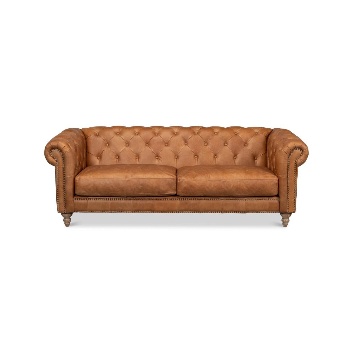 Crafted from premium top-grain leather, this sofa boasts a rich caramel hue that invites warmth into any living space. The intricate button-tufted detailing on the backrest provides a touch of aristocratic flair, while the plush cushion seat offers