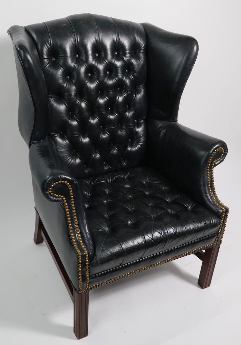 tufted leather wingback chair