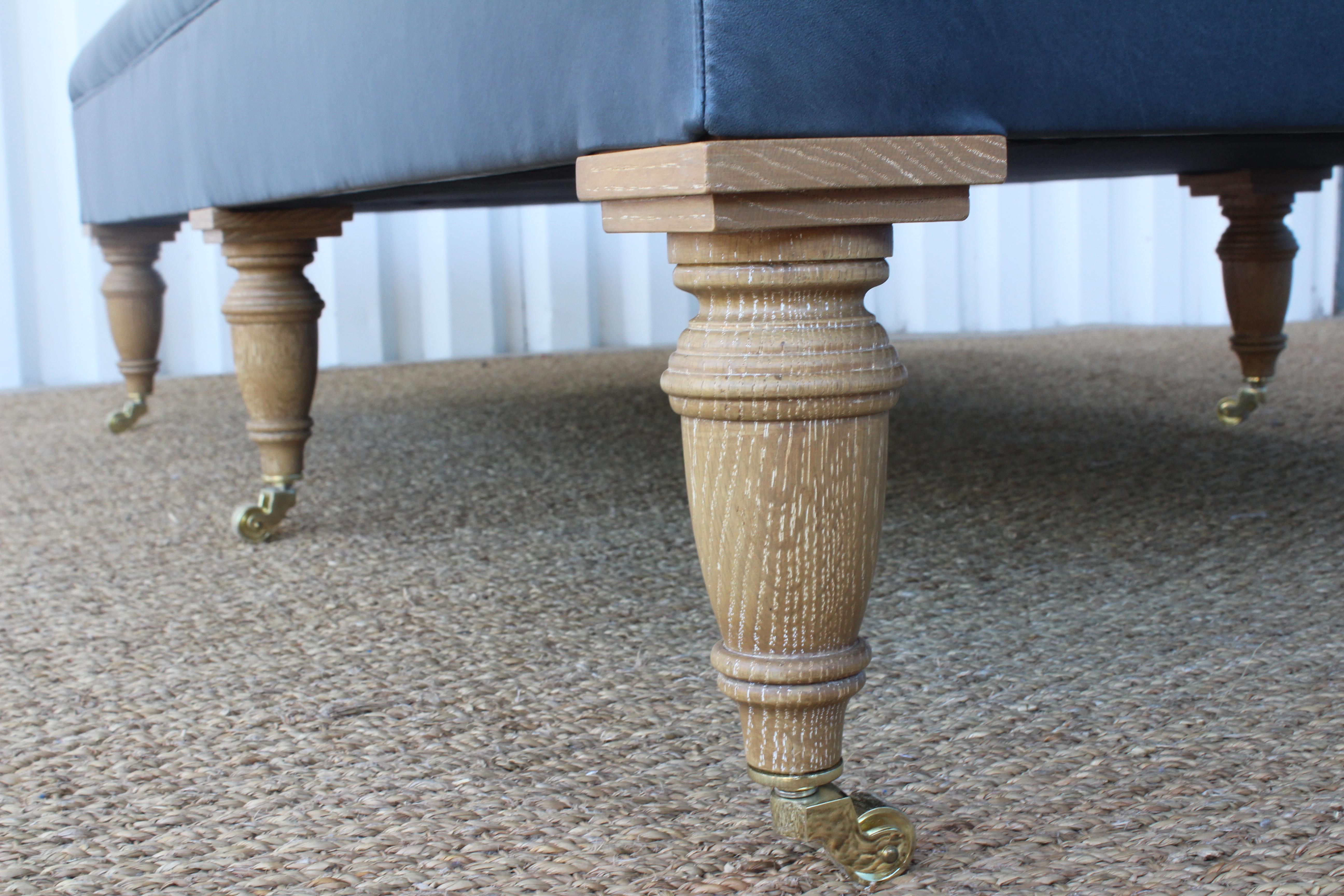 Brass Tufted Leather Upholstered Ottoman For Sale