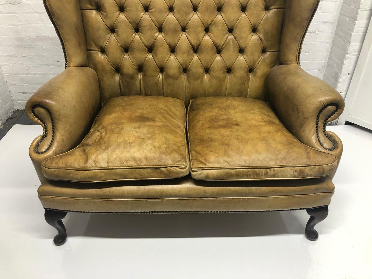 Unknown Tufted Leather Wingback Loveseat in the Style of Chippendale For Sale