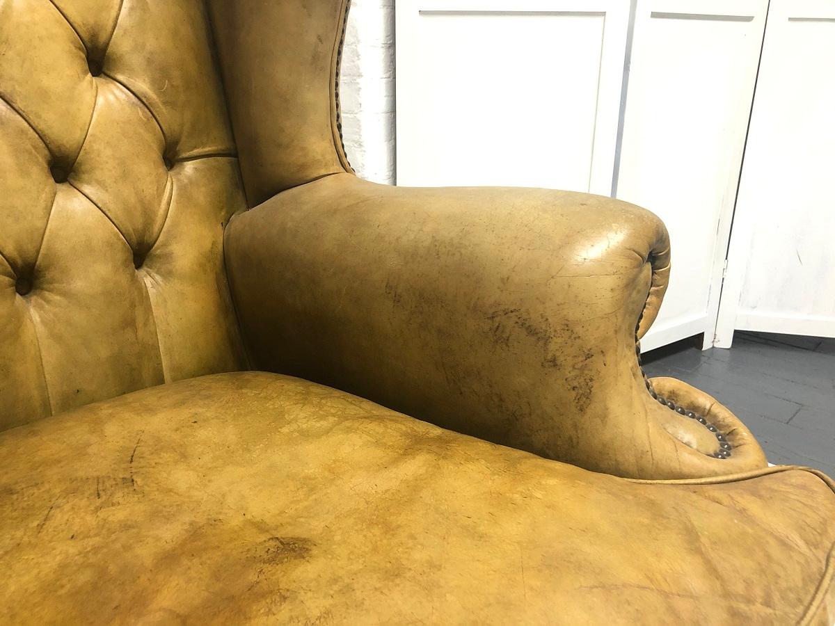 Tufted Leather Wingback Loveseat in the Style of Chippendale In Good Condition For Sale In New York, NY