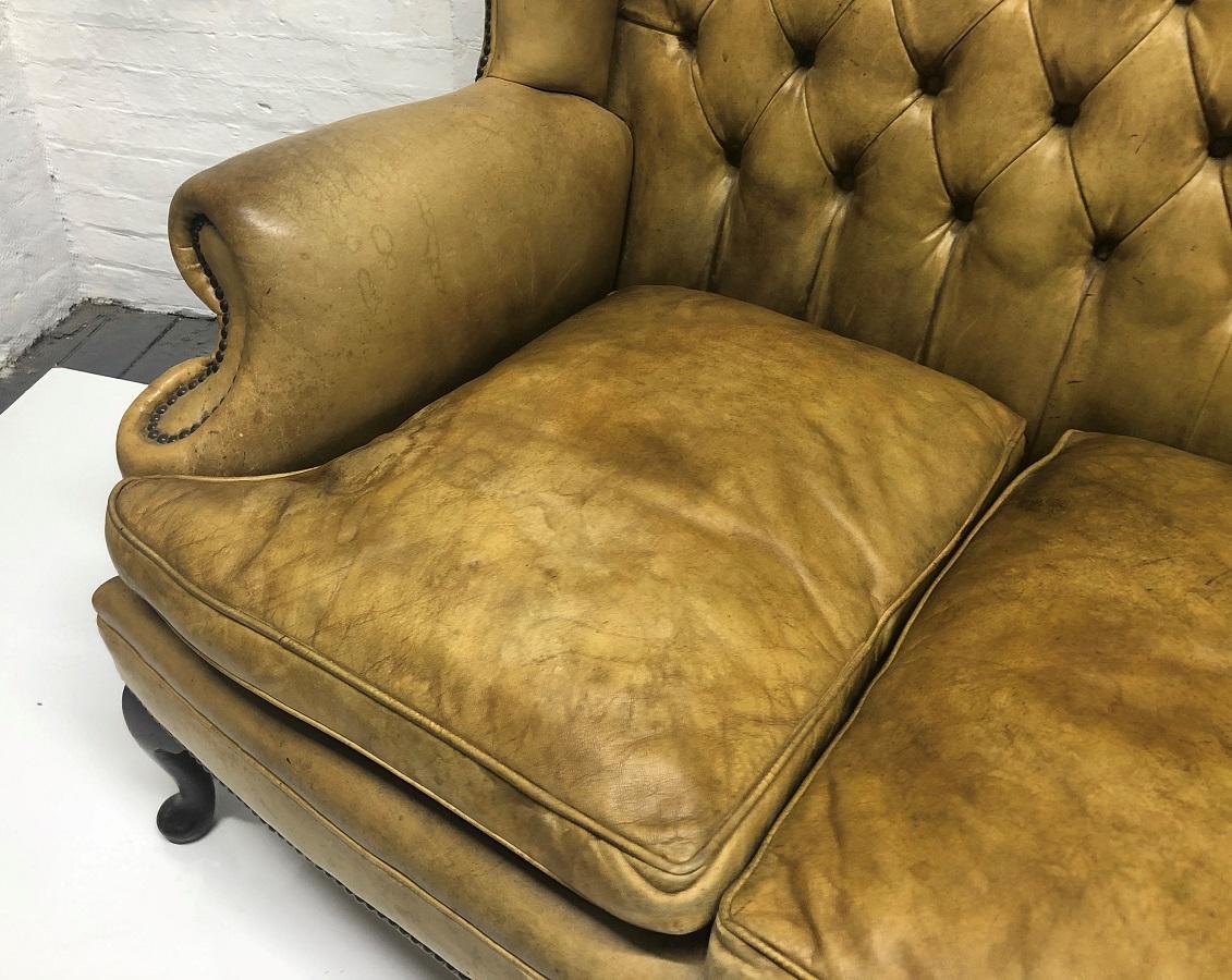 Mid-20th Century Tufted Leather Wingback Loveseat in the Style of Chippendale For Sale