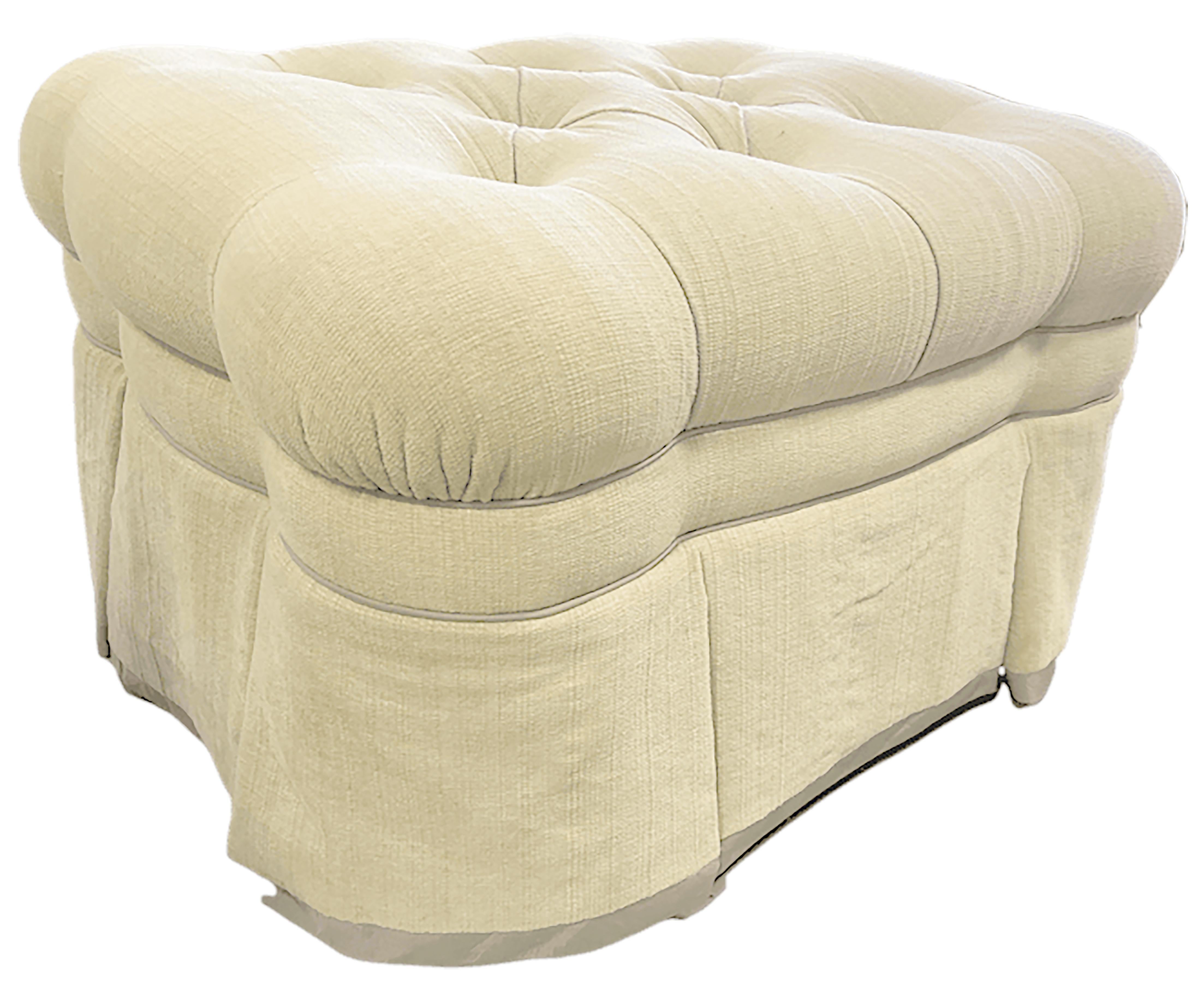 A luxurious white tufted ottoman with round buttons. The extra attention paid to expertly layered delicately upholstered, which means an increased longevity of the supportive material for this furniture piece. The body of the ottoman is made up of