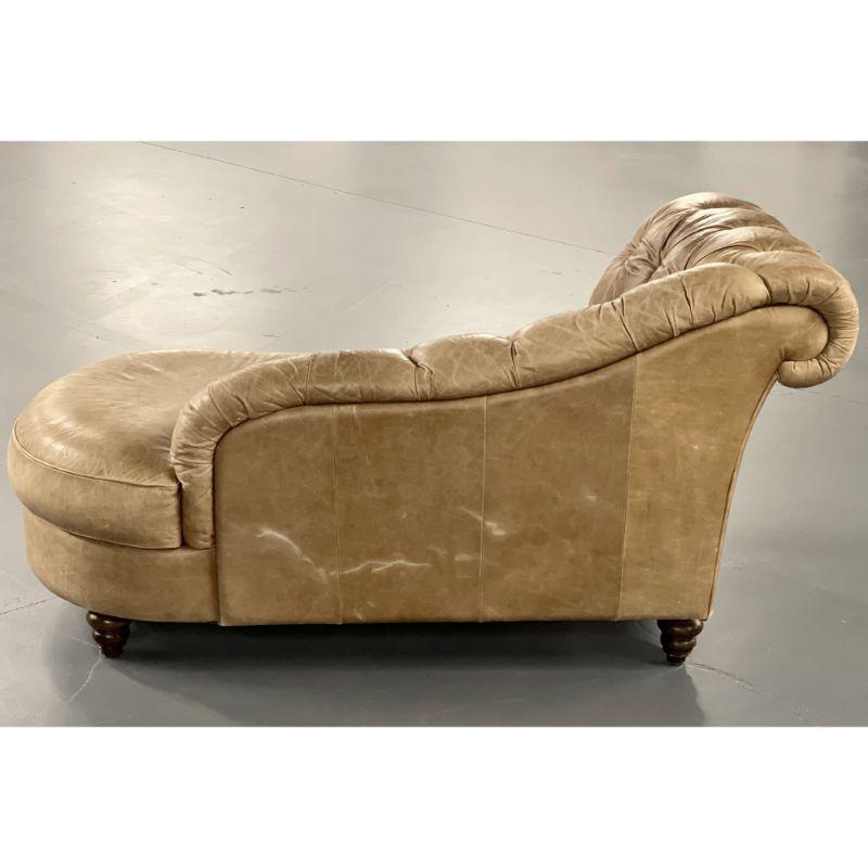 20th century patinated vintage leather chaise lounge or daybed from Sweden
 
Unique form Chesterfield chaise lounge in original leather tufted upholstery. The cornered back is tufted with brown leather buttons and is complete with a scroll type