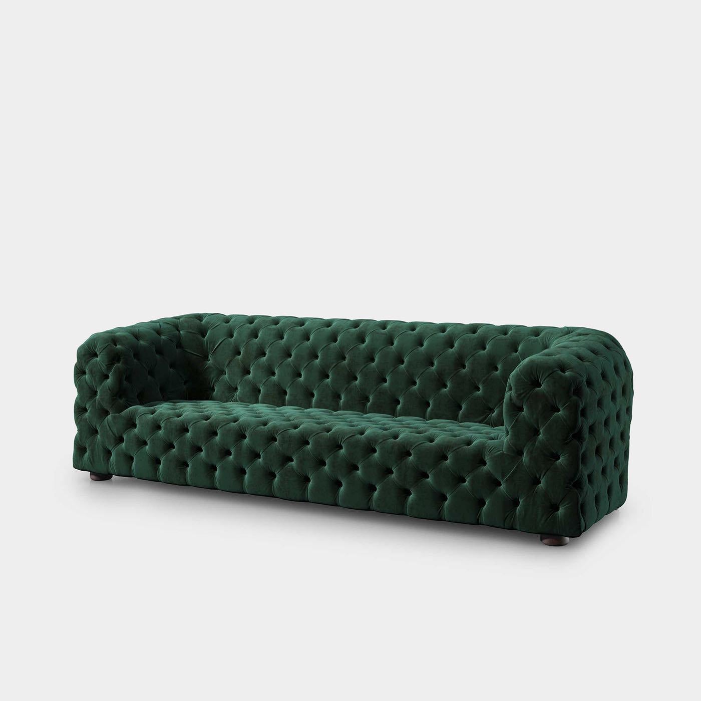 A captivating synthesis of opulent, Louis XIV's-style upholsteries and modern, streamlined volumes, this refined sofa will be a lavish focal point in any decor. Distinguished by the intricate button-tufting and emerald-hued velvet upholstery, its