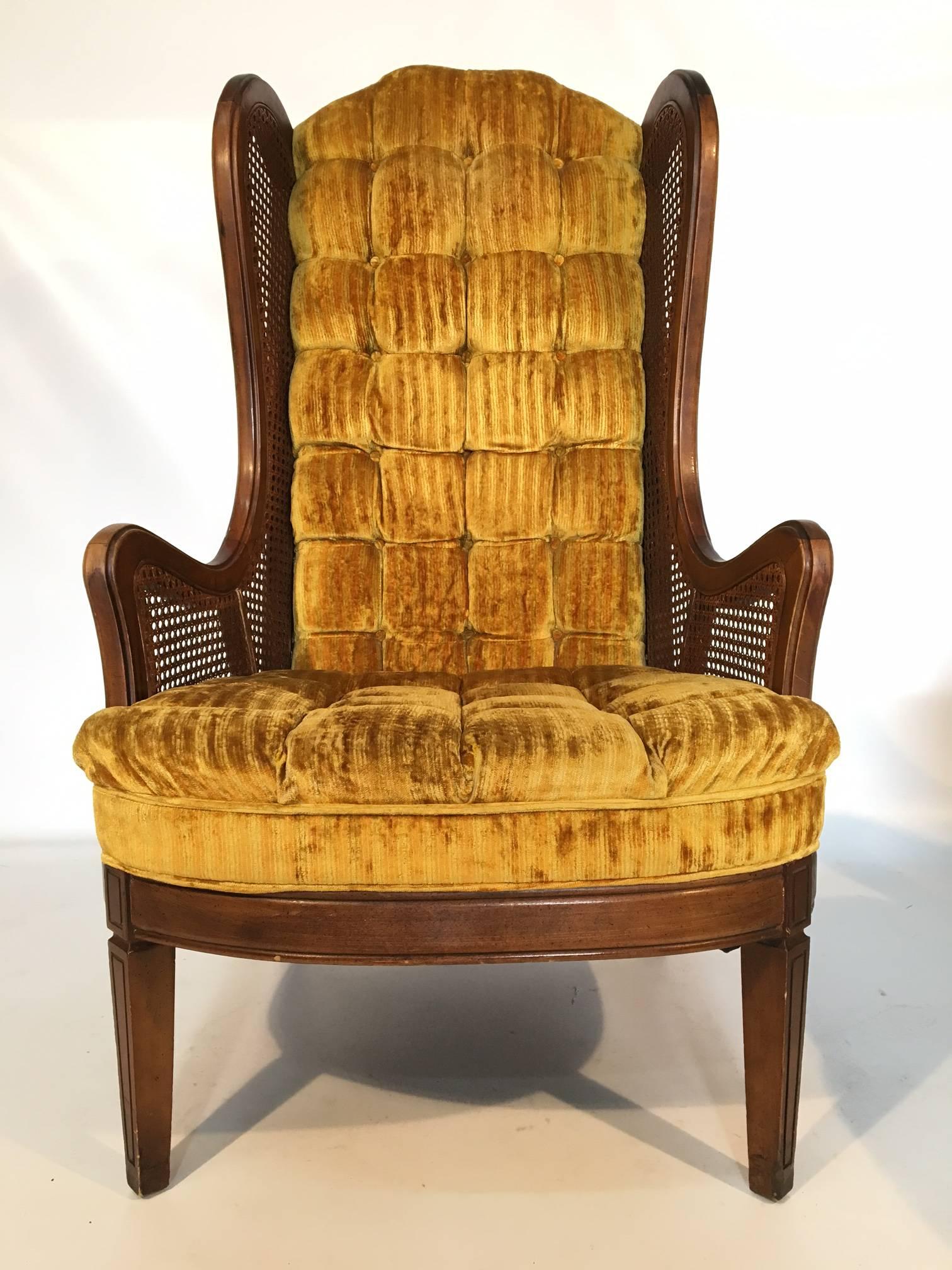 Pair of Lewittes cane wingback chairs in gold velvet. Features full tufting from back to seat. Caning in near perfect condition. Upholstery in excellent condition and frame also in excellent condition, save for the slight wear on arms.
Measures: