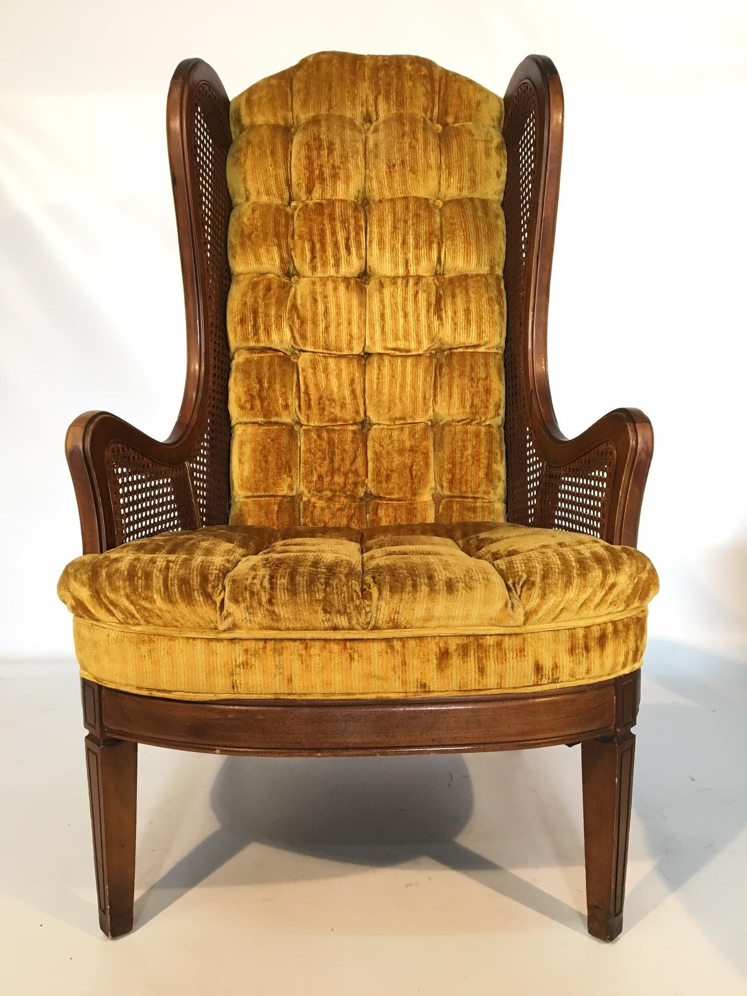 Pair of Lewittes cane wingback chairs in gold velvet. Features full tufting from back to seat. Caning in near perfect condition. Upholstery in excellent condition and frame also in excellent condition, save for the slight wear on arms.
Measures: