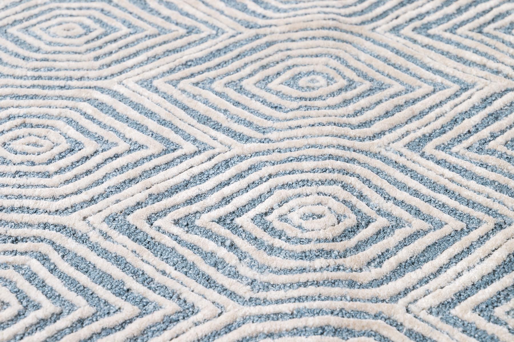 Tufted wool custom rug. Custom sizes and colors made-to-order.

Material: Wool 
Lead time: Approximate 15-20 weeks available 
Colors: As shown (Ivory, Blue), other custom colors and styles available 
Made in Tibet 
Price shown is for an 8' x