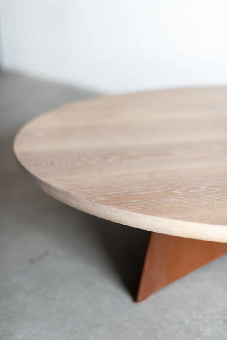 The Tula Coffee Table takes the subtle design of the Tula Dining Table and transforms it into a more intimate setting. The round top, available in multiple wood finish options, features a half bullnose edge that mirrors the slight curves of the