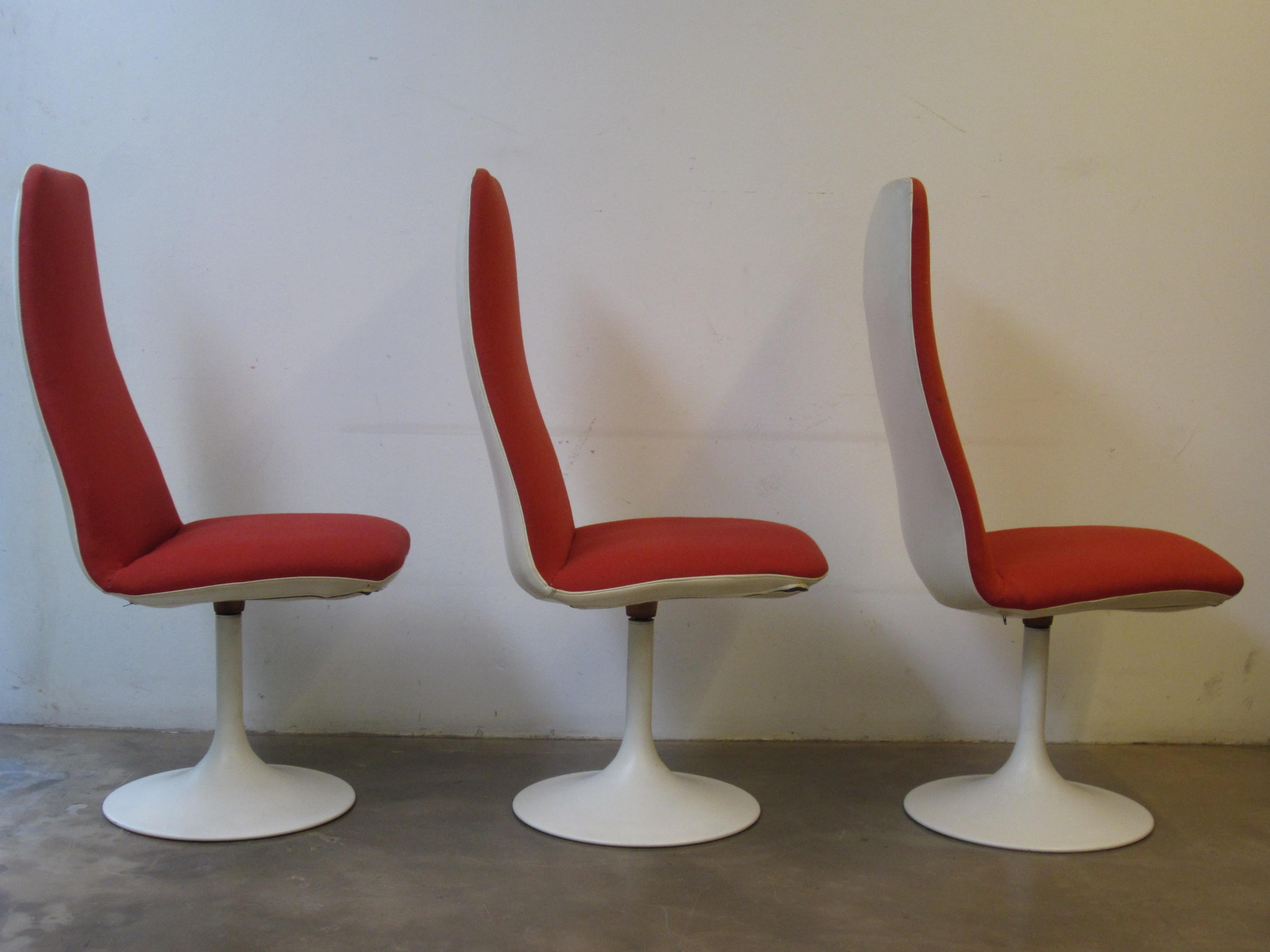 Century modern tulip base dining chairs. The fabric is original and has some wear.