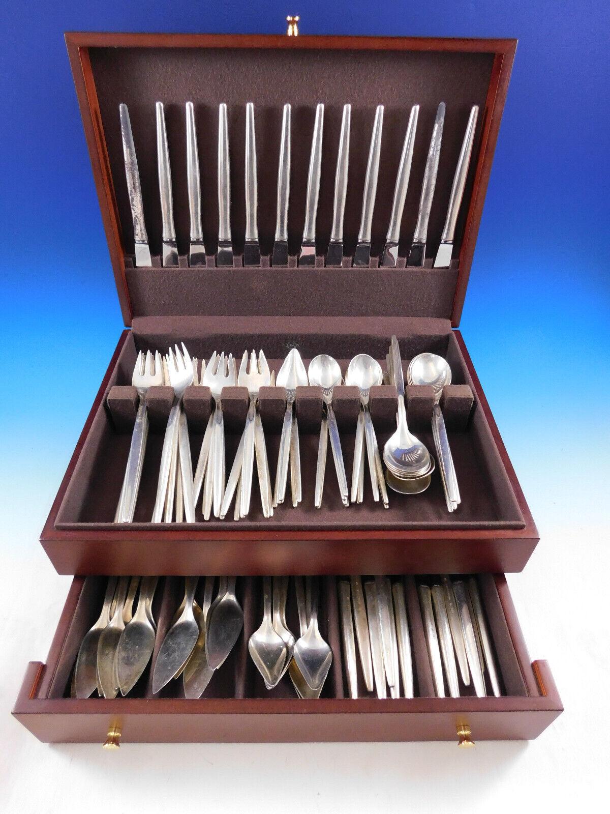 Stunning Scandinavian Modern Tulip by A. Michelsen sterling silver Flatware set with modern elongated handles, 96 pieces. This set includes:

12 Knives, 8 1/2
