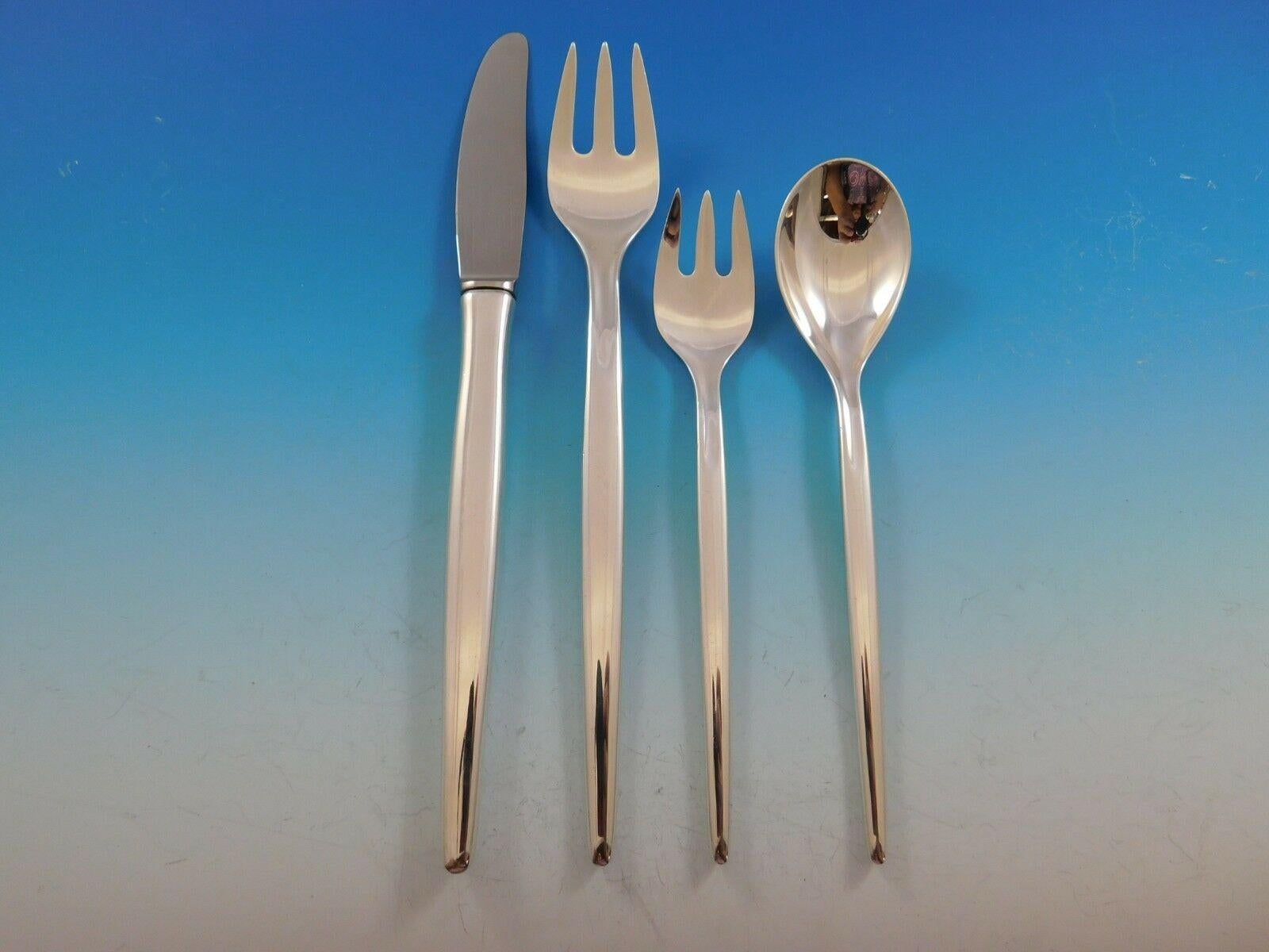 Mid-Century Modern Tulip By Michelsen sterling silver flatware set with unadorned modern elongated handles, 88 pieces. This set includes:

12 dinner size knives, 8 3/8