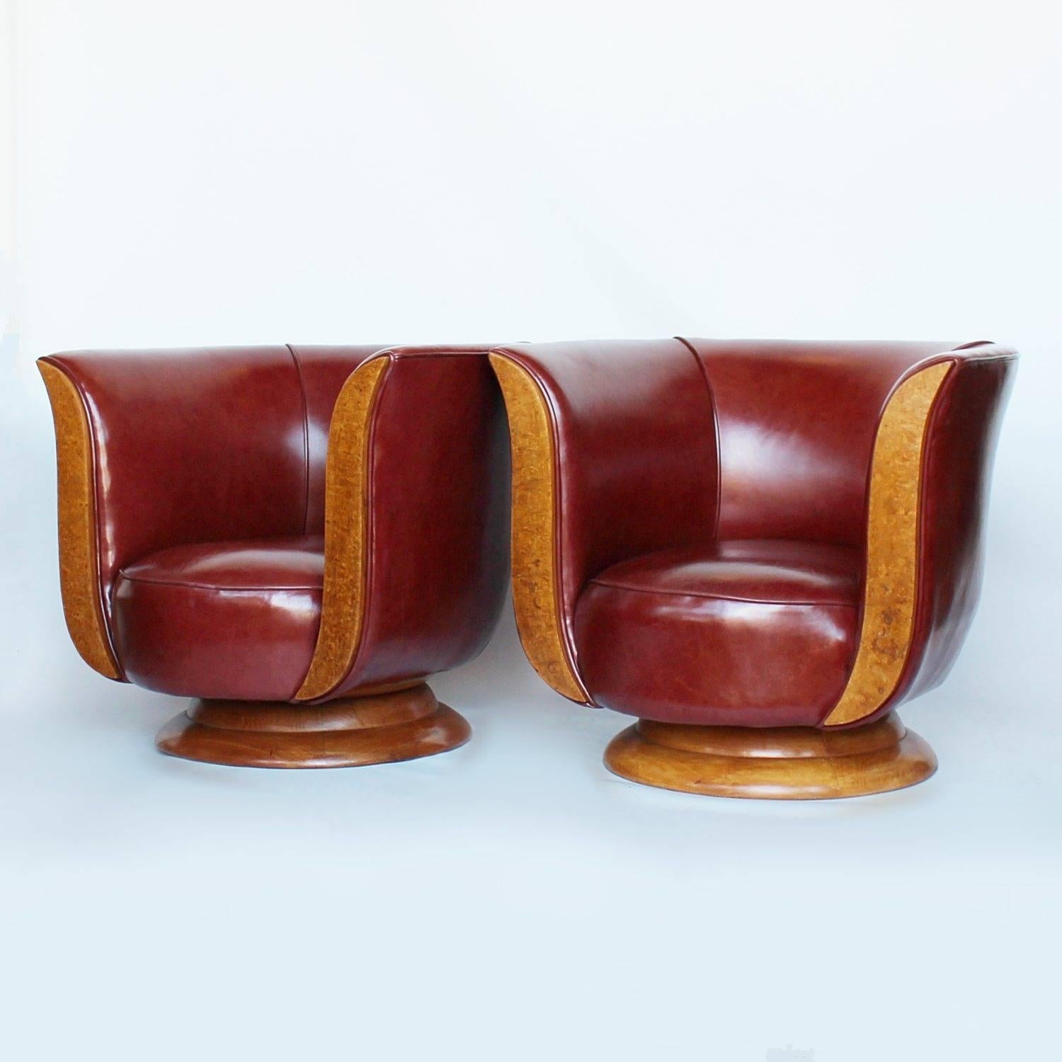 A pair of Art Deco tulip chairs with burr walnut show wood and solid walnut circular base. Upholstered in chestnut leather.
Dimensions:
 H 61cm, W 74cm, D 70cm, 
Seat H 29cm, Seat D 50cm
Origin: French
Date: circa 1930
Item No: 2802181.