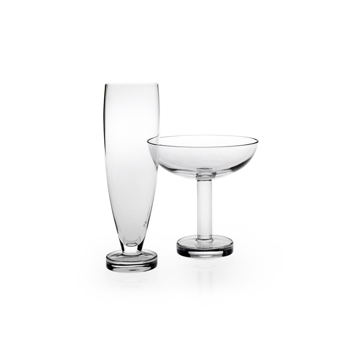 Champagne flute made in blown in a mold glass. The Tulip collection is a glassware family by Aldo Cibic, who designed these pieces walking the line between classical and postmodern design. The boldly simple geometric forms are at once contemporary