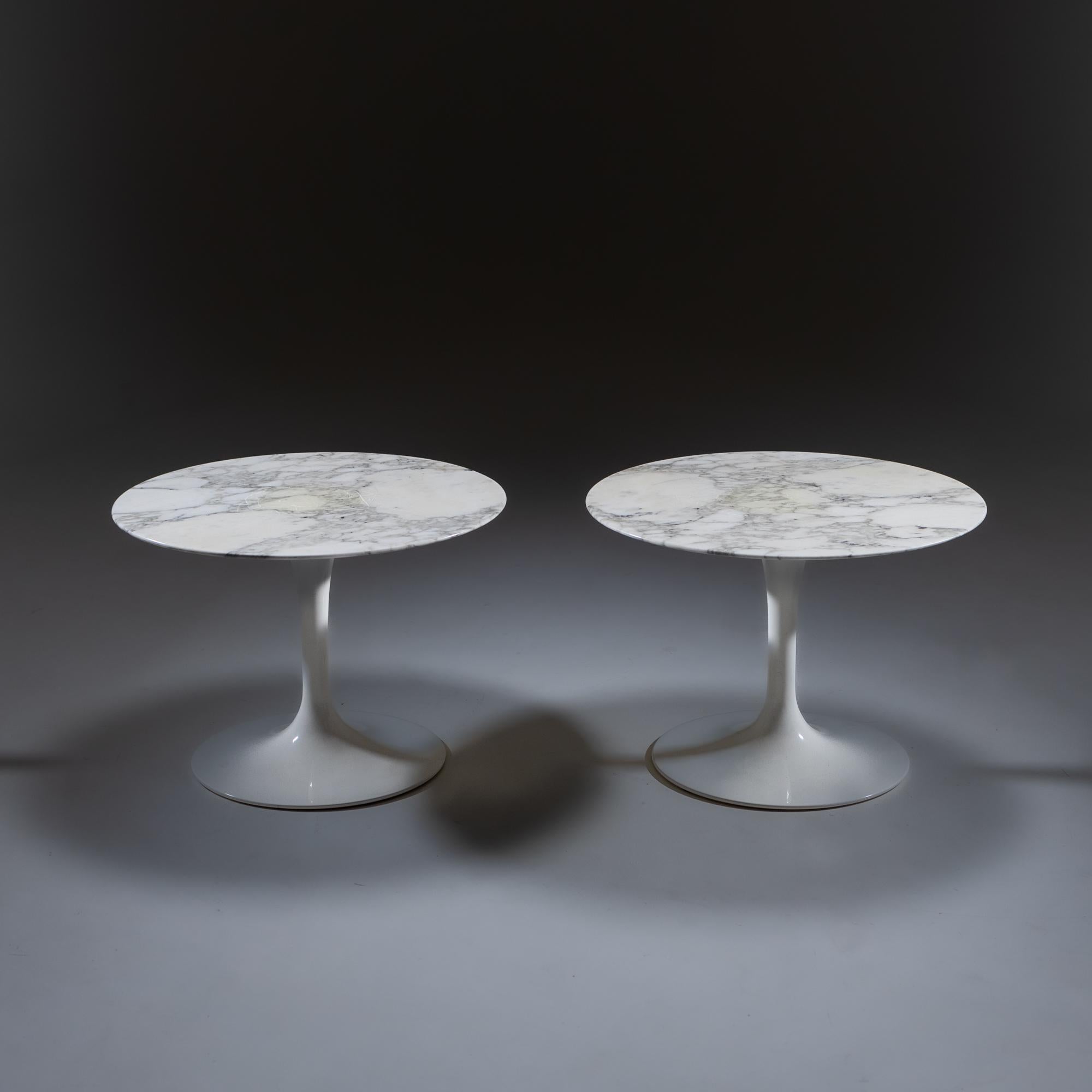 Pair of coffee tables by Eero Saarinen with a white tulip shaped base and round marble top.