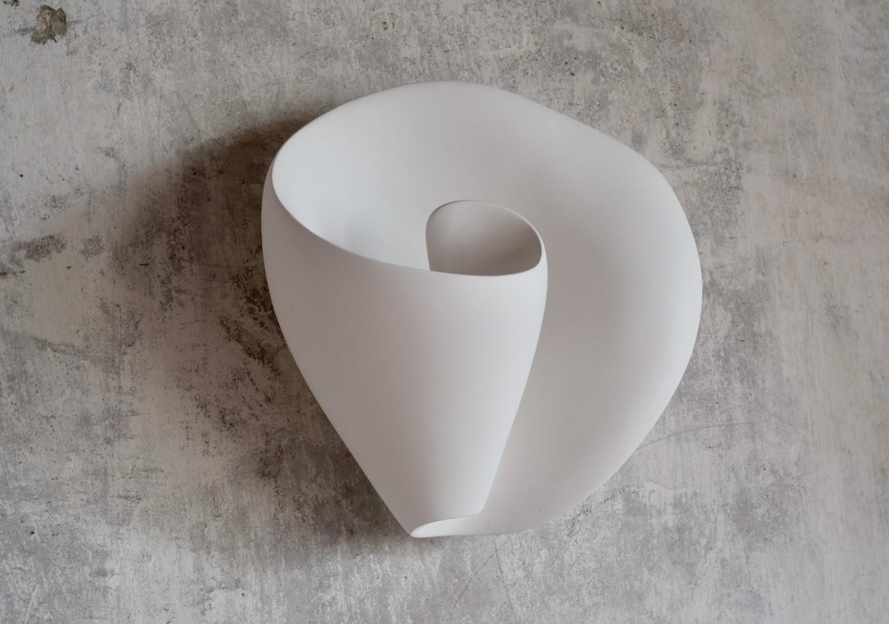Handmade Tulip wall-mounted sculpture, in silky smooth white plaster, created by artist Hannah Woodhouse in her London studio. Contemporary design inspired by nature and midcentury European sculpture. Height 11.8