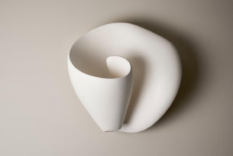 Handmade Tulip organic modern wall light/ wall sconce, in silky smooth white plaster, created by artist Hannah Woodhouse in her London studio. Contemporary organic modern design inspired by nature and midcentury European sculpture. The Tulip wall