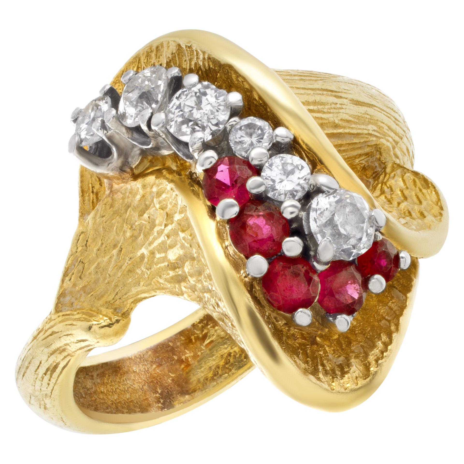 Abstract tulip design ruby & diamond ring in 18k yellow gold. Size: 9.5. Ring length: 18.4mm & width: 22mm.

This Diamond/Ruby ring is currently size 9.5 and some items can be sized up or down, please ask! It weighs 9.5 pennyweights and is 18k.