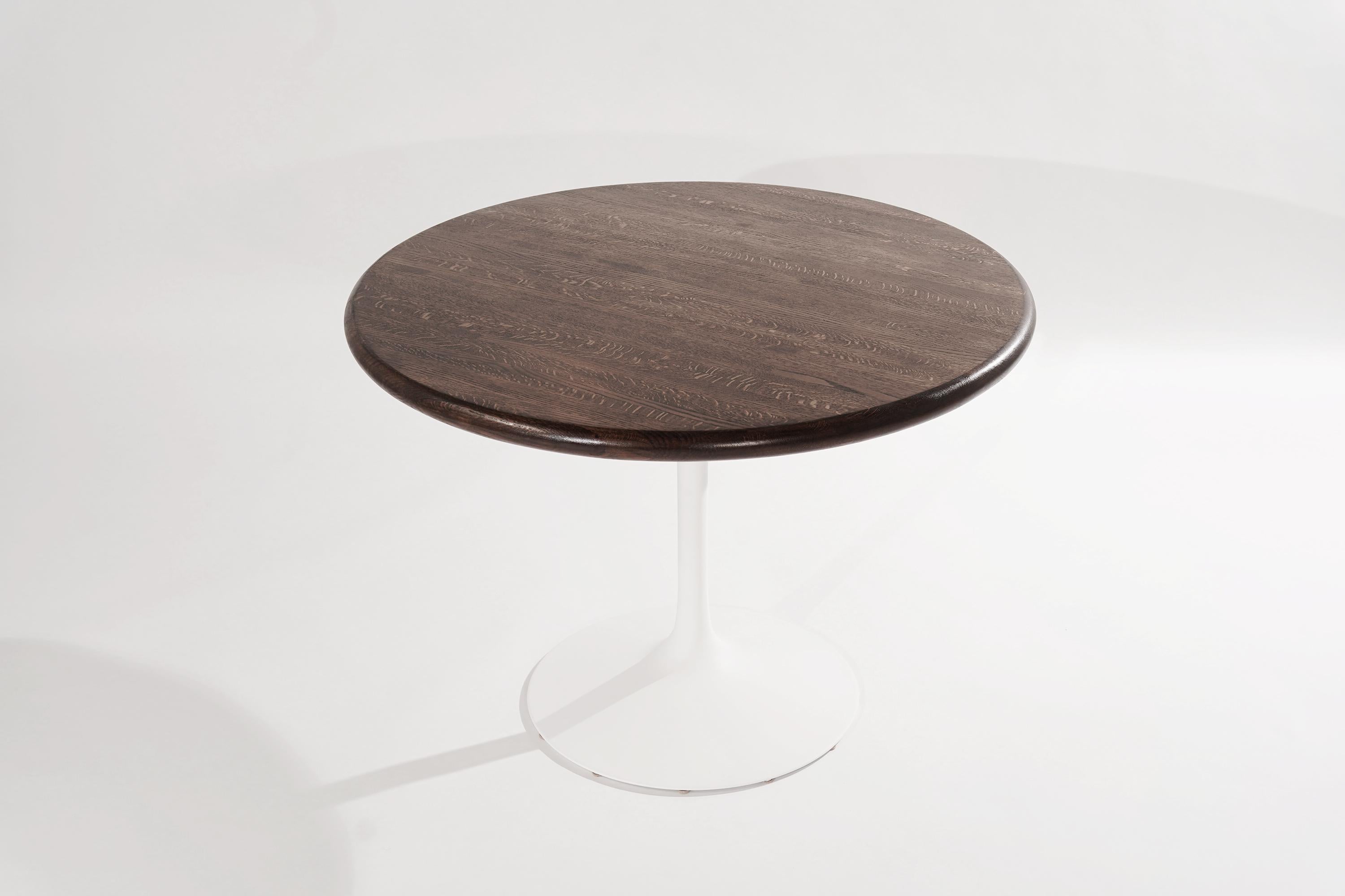 Tulip center or breakfast table in the style of Eero Saarinen for Florence Knoll, circa 1950-1959.
Completely restored, fiberglass pedestal re-painted in matte white, solid oak top refinished in medium brown.

Other designers from this period