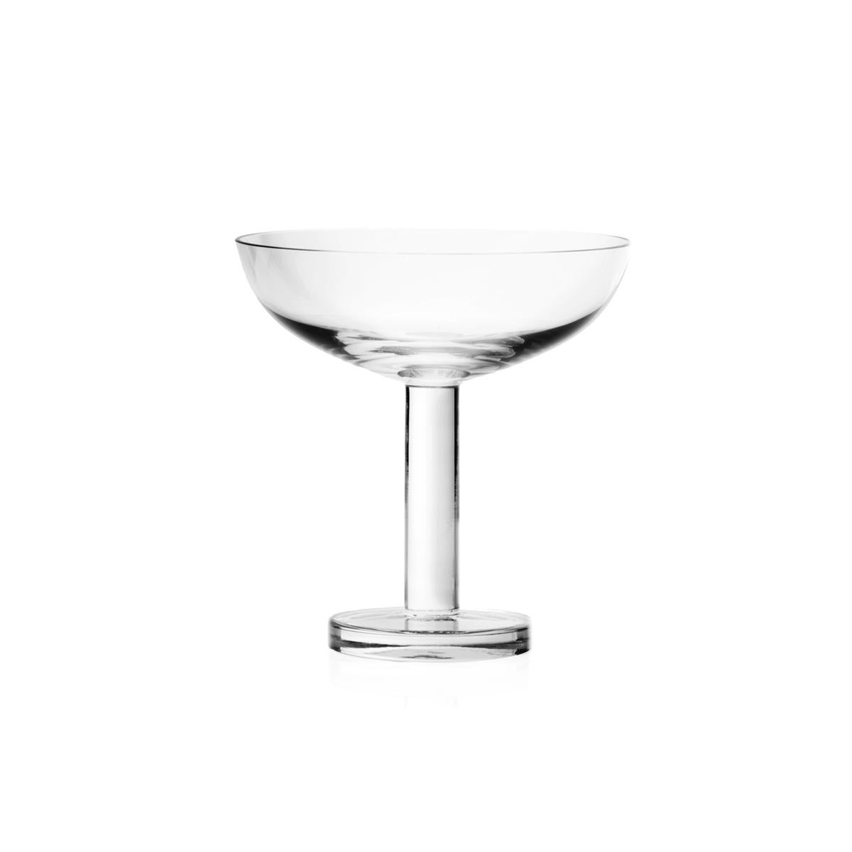 Champagne or martini glass made in blown in a mold glass. The Tulip collection is a glassware family by Aldo Cibic, who designed these pieces walking the line between classical and postmodern design. The boldly simple geometric forms are at once