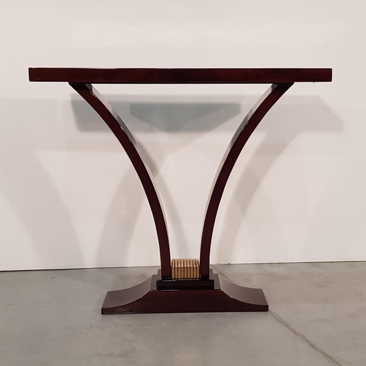 Elegant typical French Art Deco tulip-shape console with walnut veneer and brass ornament on the bottom from art deco period, France, 1930-1940.