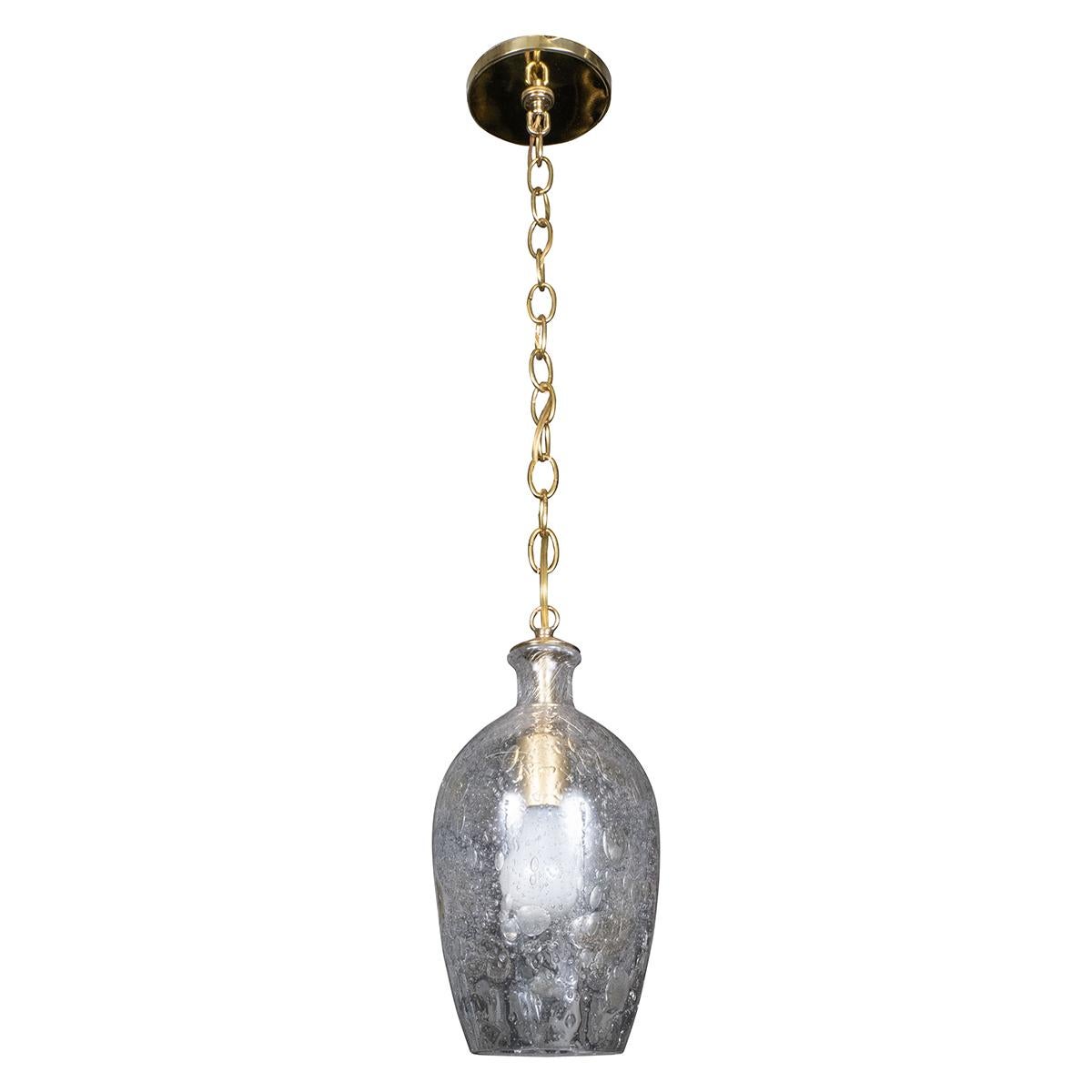 Tulip-shaped glass pendant with large inclusive air bubbles and brass hardware.