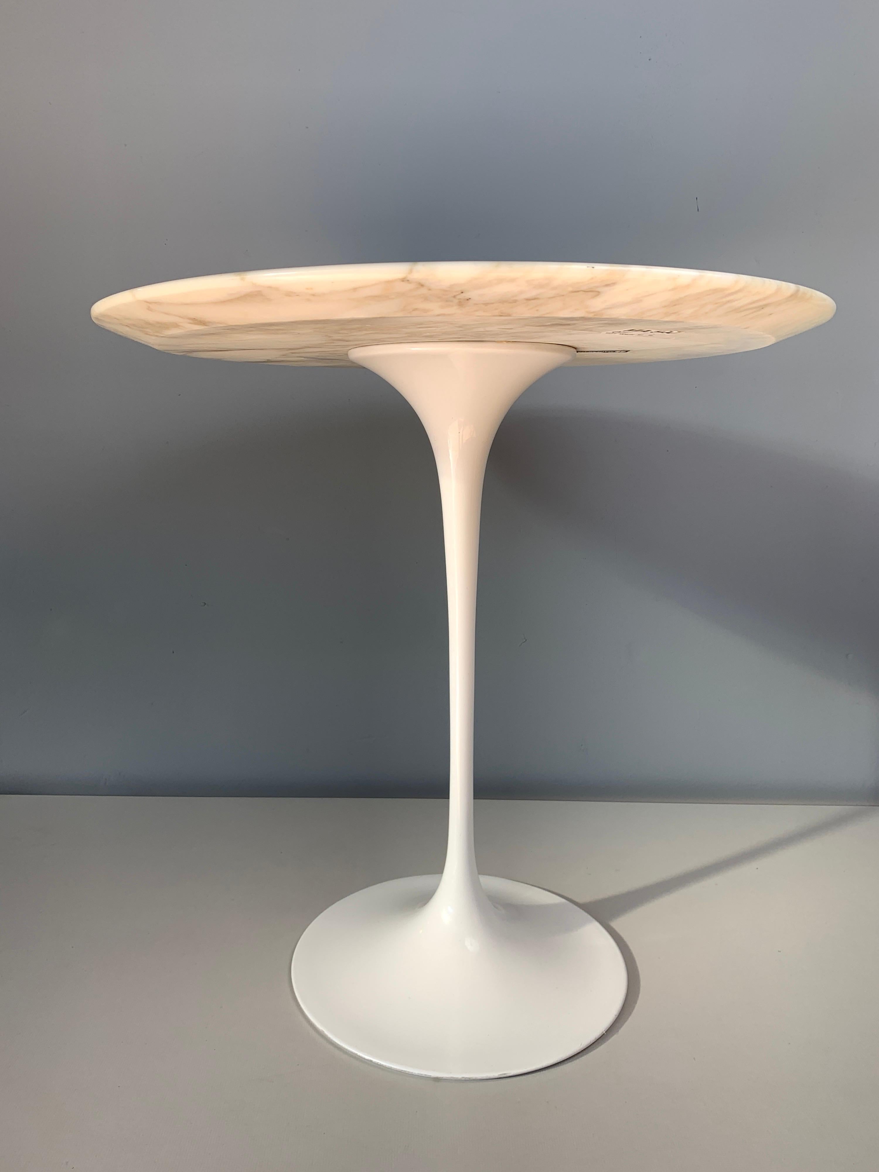 A timeless classic from Eero Saarinen. Smooth pedestal base leading up toward a clean and soft miter-edged Calacatta marble top. Two Available, numbered accordingly. 1&2.