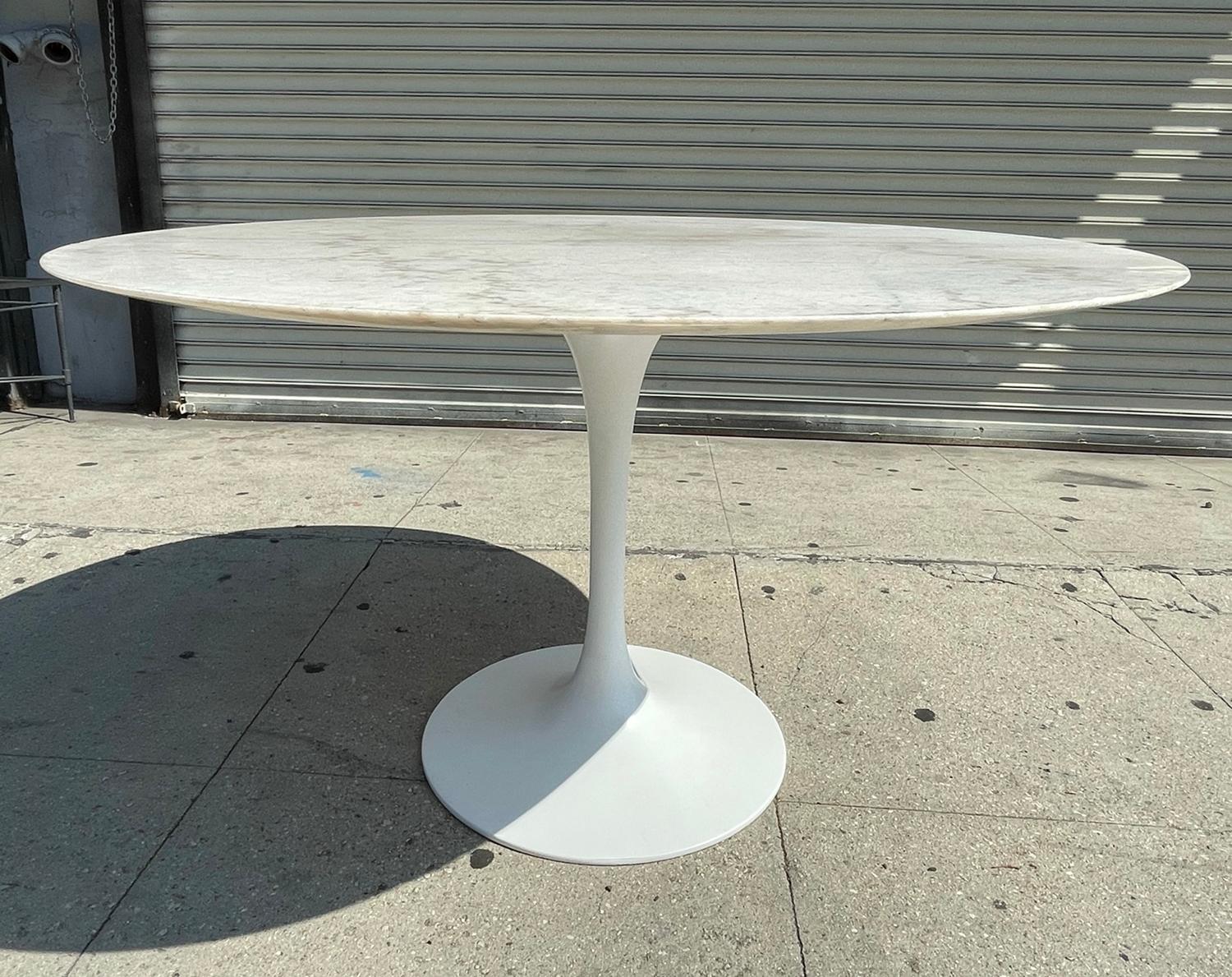 Beautiful round dining or center table having a tulip stile metal base topped with a round granite top.

Measurements:
48 inches round x 28 inches high x 27 inches to the bottom of the table.