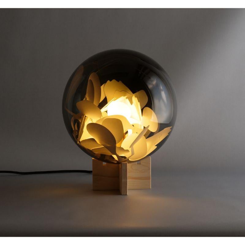 Tulip table light by Lina Rincon
Dimensions: H42 x D30 cm
Materials: Glass, Wood

All our lamps can be wired according to each country. If sold to the USA it will be wired for the USA for instance.

Colors and dimensions may slightly vary,