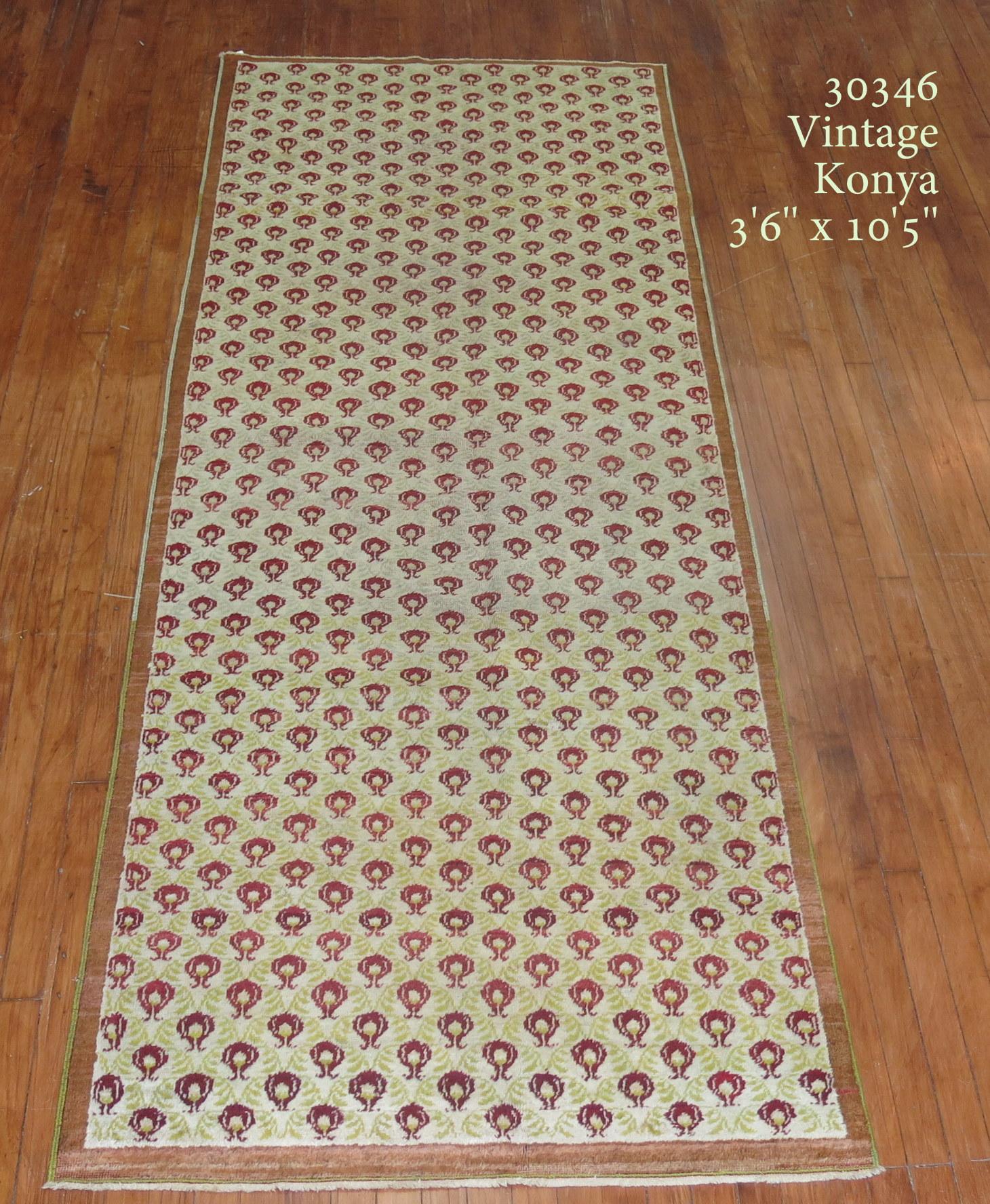 One of a kind decorative Vintage Turkish Konya runner with running red tulips on a neutral field

Measures: 3'6'' x 10'5''.