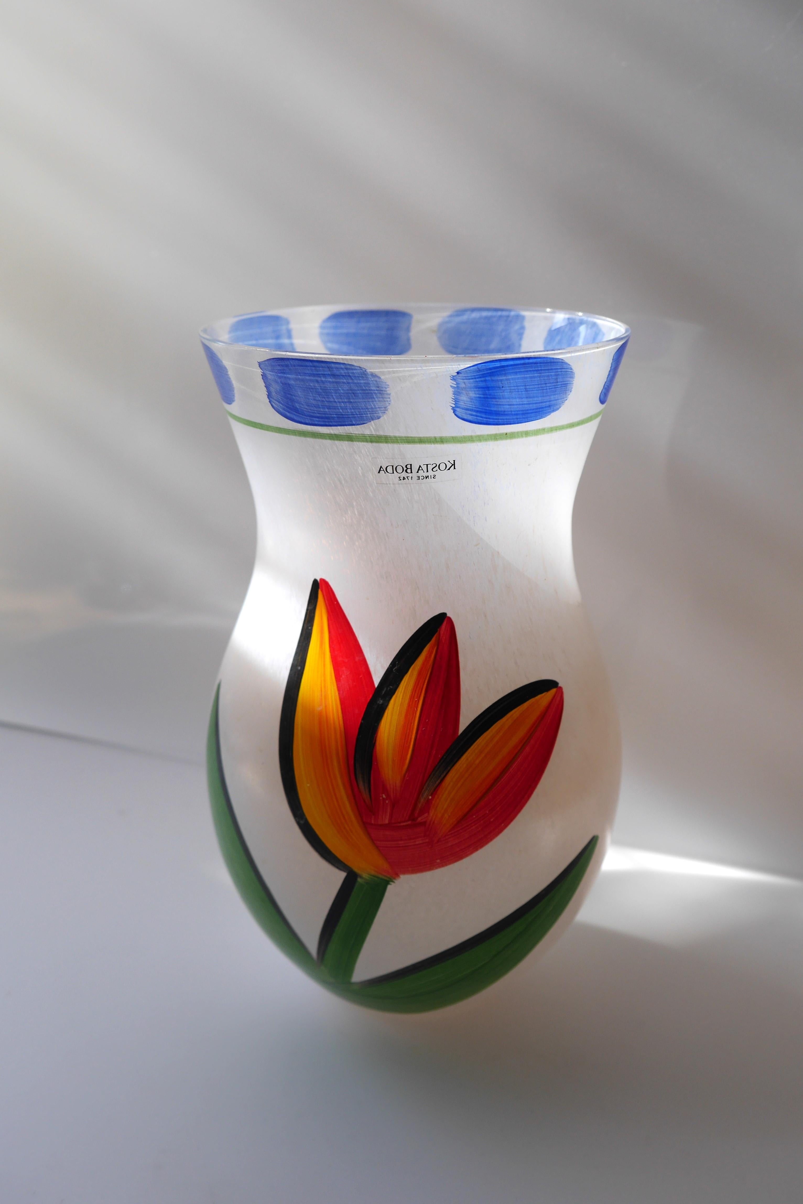 A signed and handmade and hand painted glass vase known as 